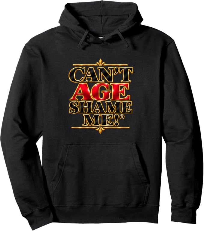 Black pullover hoodie with gold and red lettering reading “Can’t Age Shame Me!®,” framed by gold decorative accents.