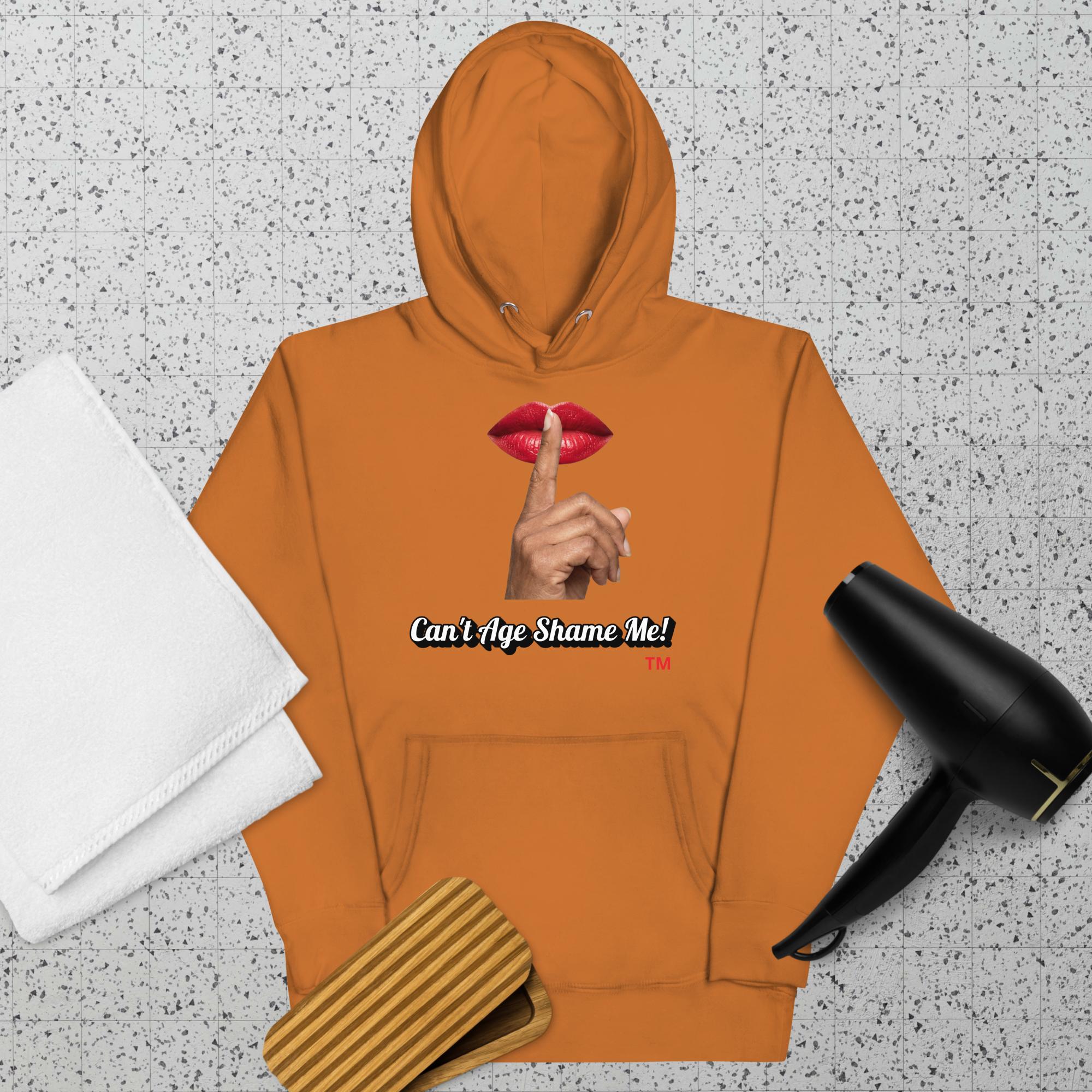 Adobe hoodie with a graphic design of lips and a finger on a textured surface