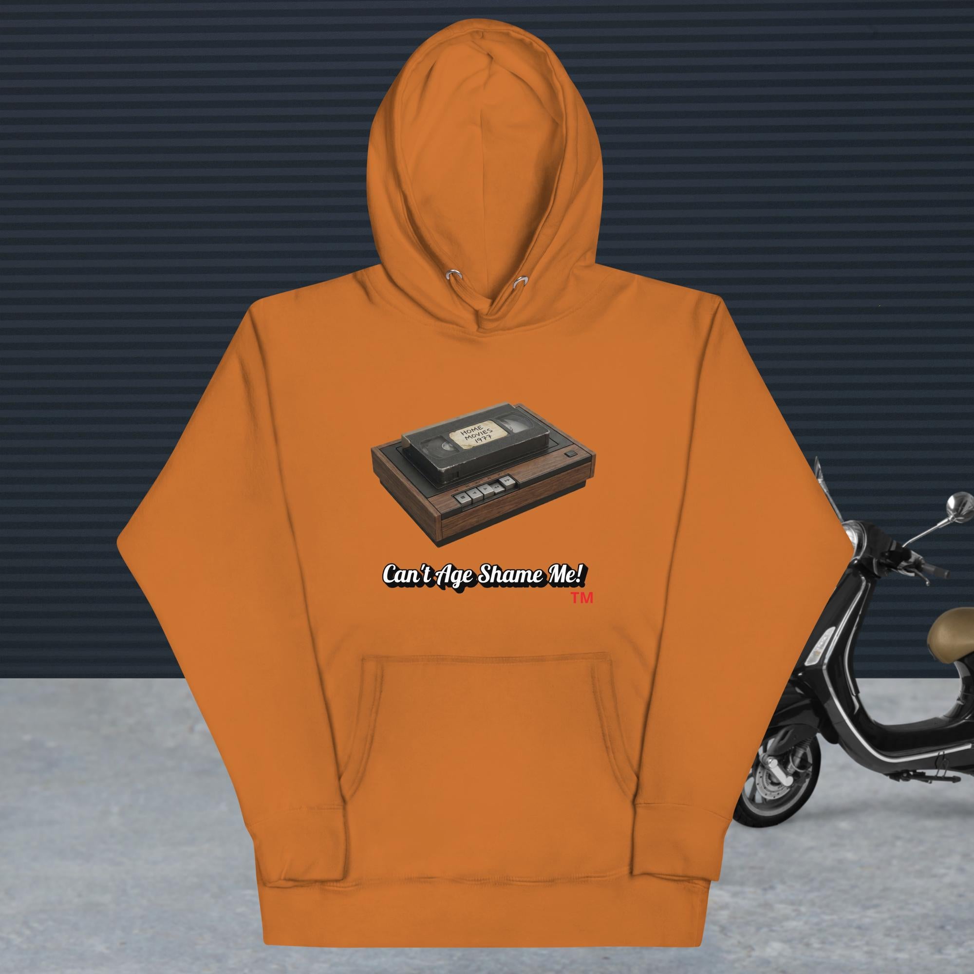adobe hoodie with a design of vhs recorder and tape