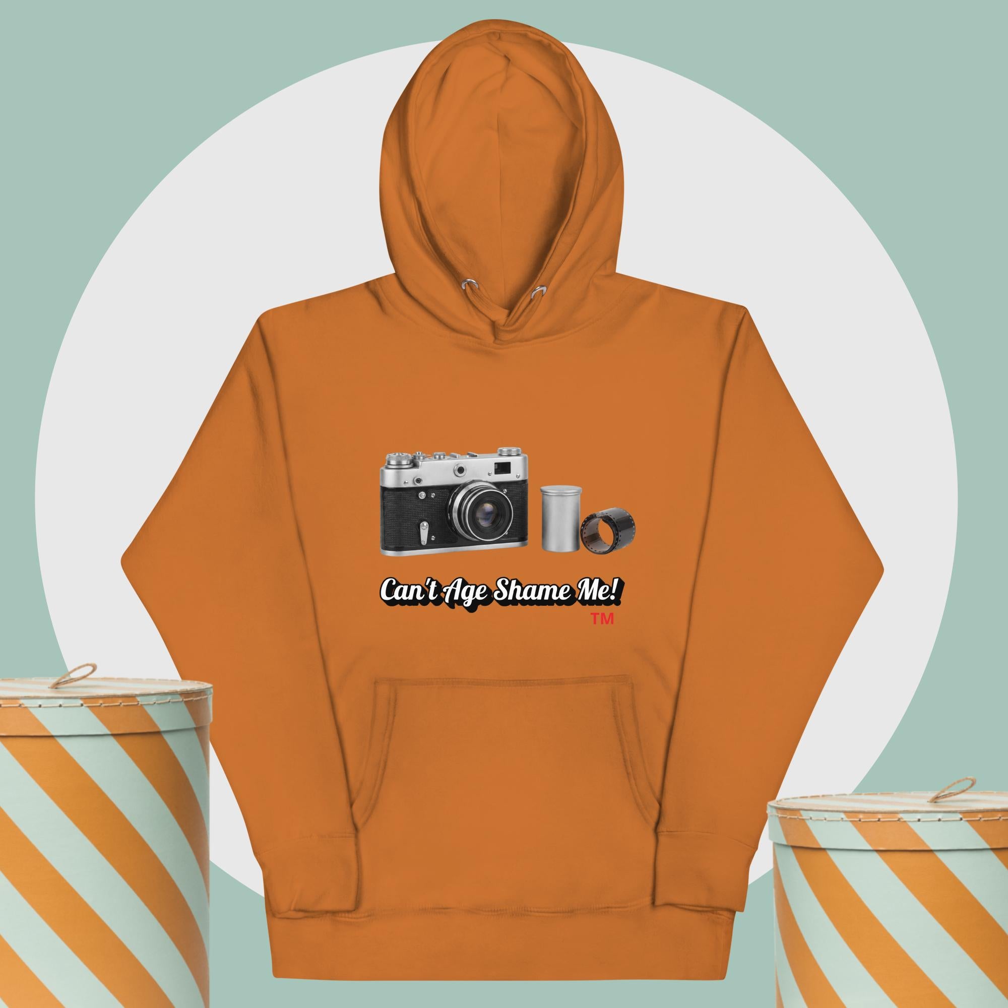 latte hoodie with camera graphic background two yellow and white hat boxes