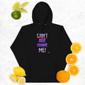 Black hoodie with colorful text 'CAN'T AGE SHAME ME!' surrounded by fruits on a light background