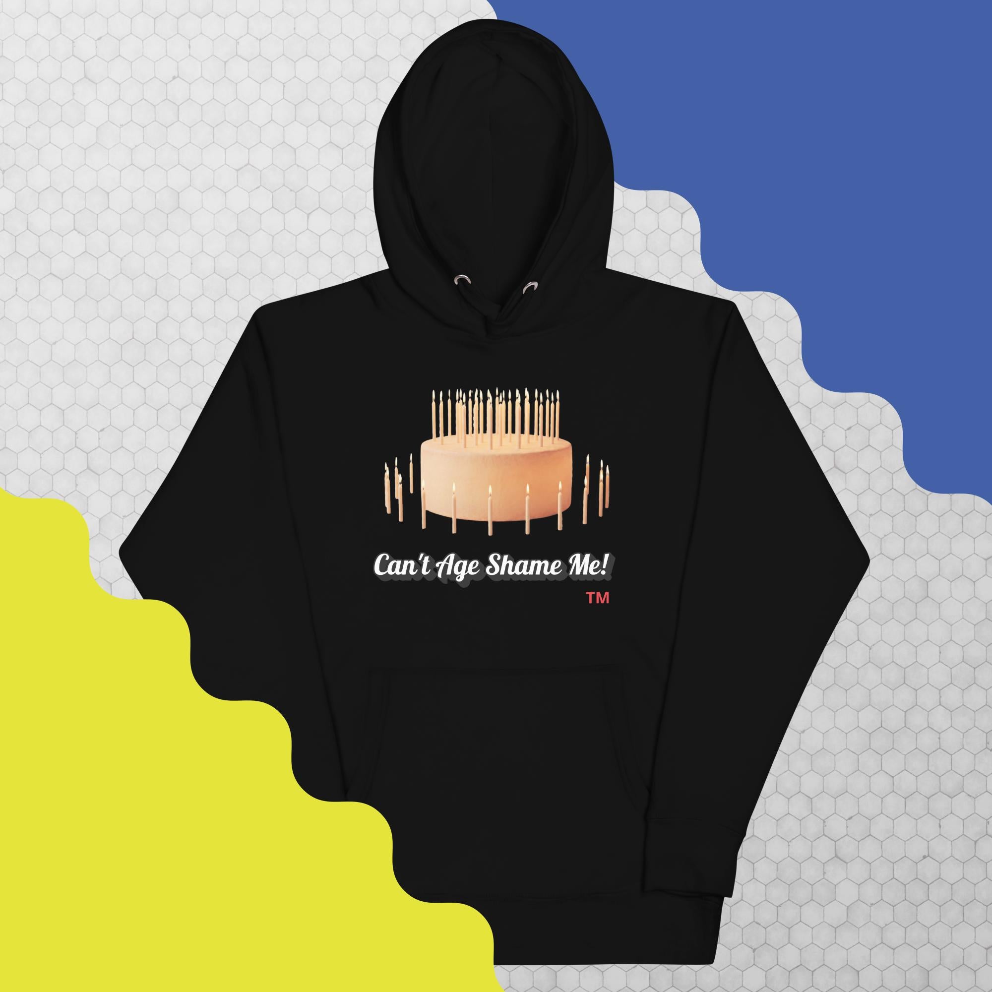 Black hoodie with birthday cake graphic and text on a colorful background