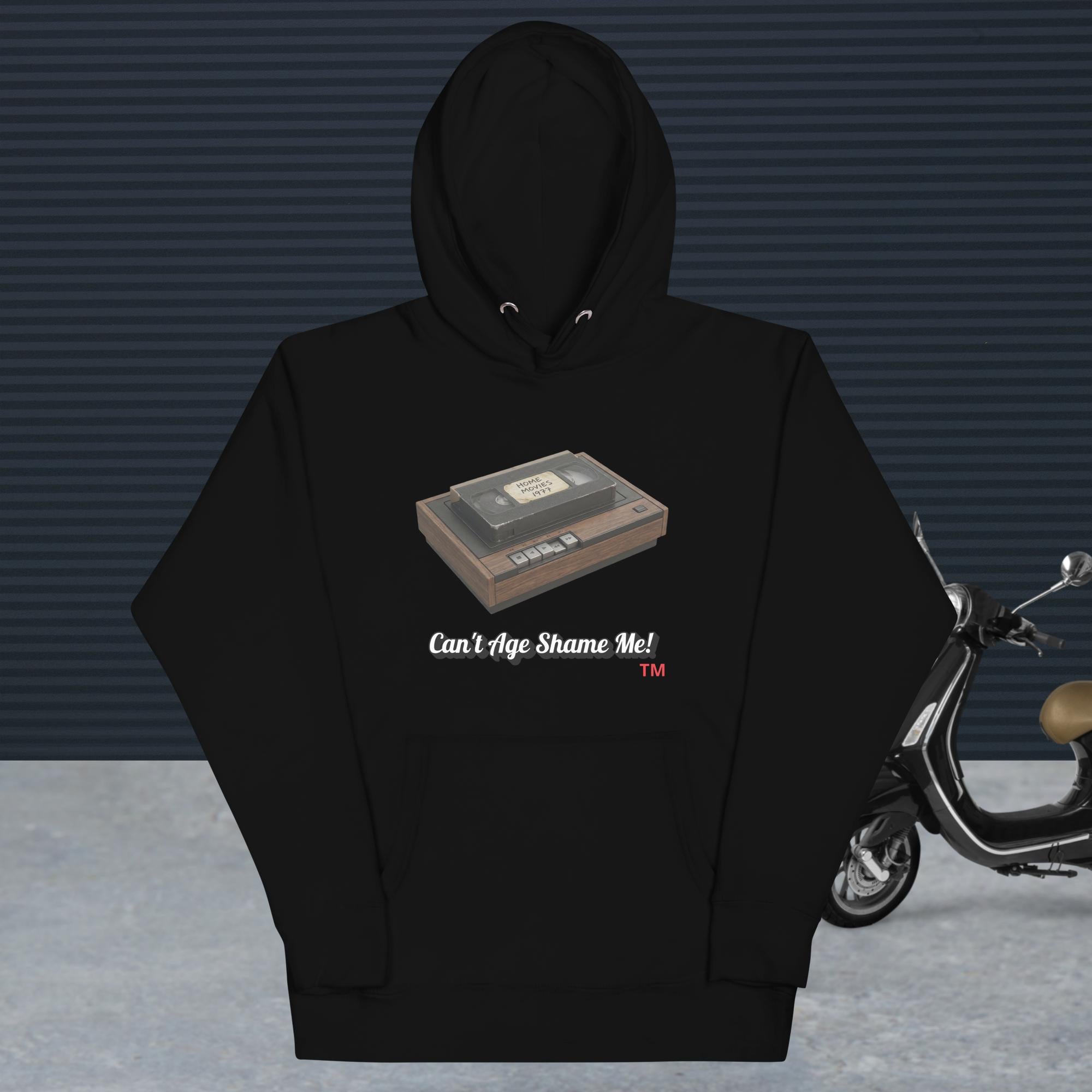 black hoodie with a design of vhs recorder and tape