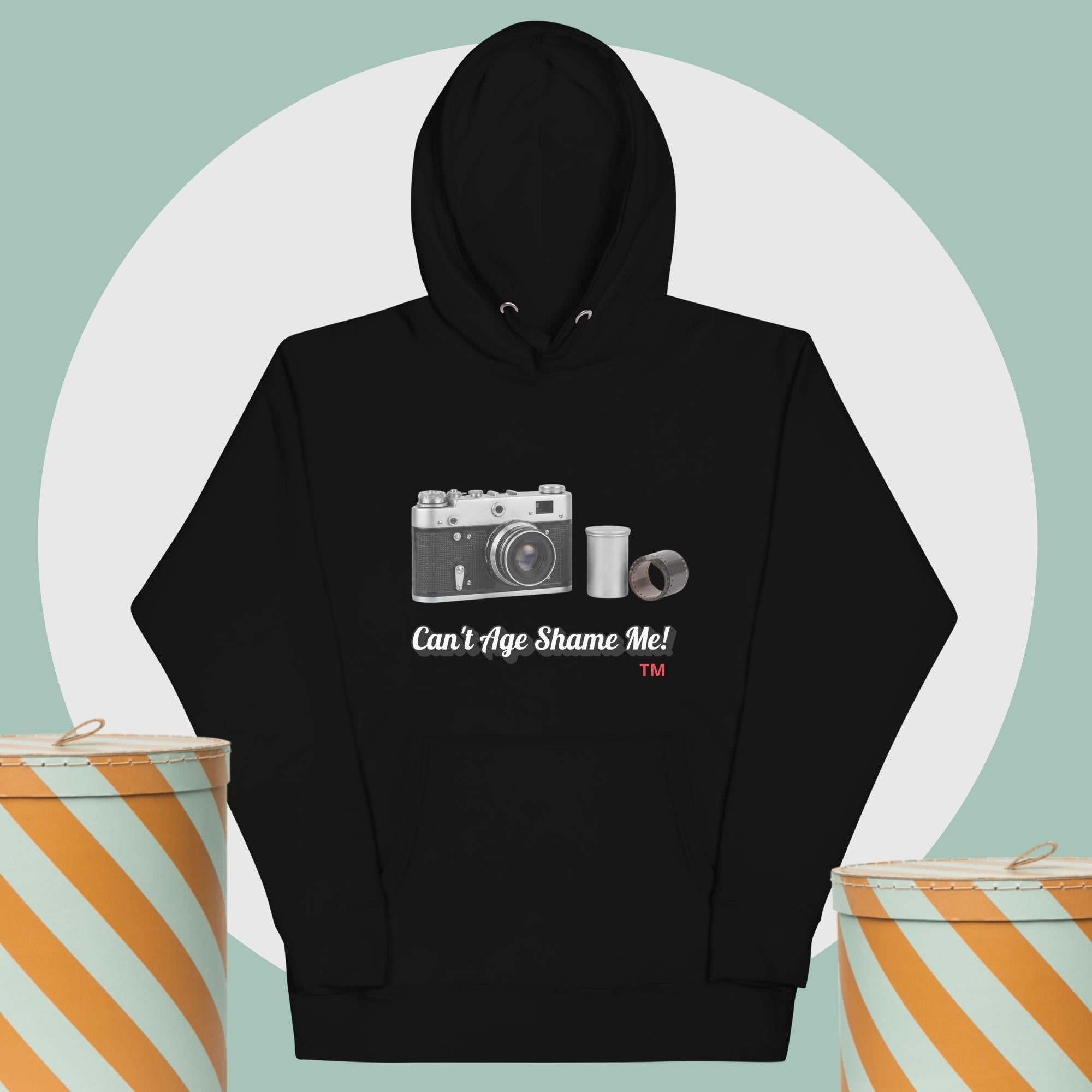 black  hoodie with camera graphic background two yellow and white hat boxes