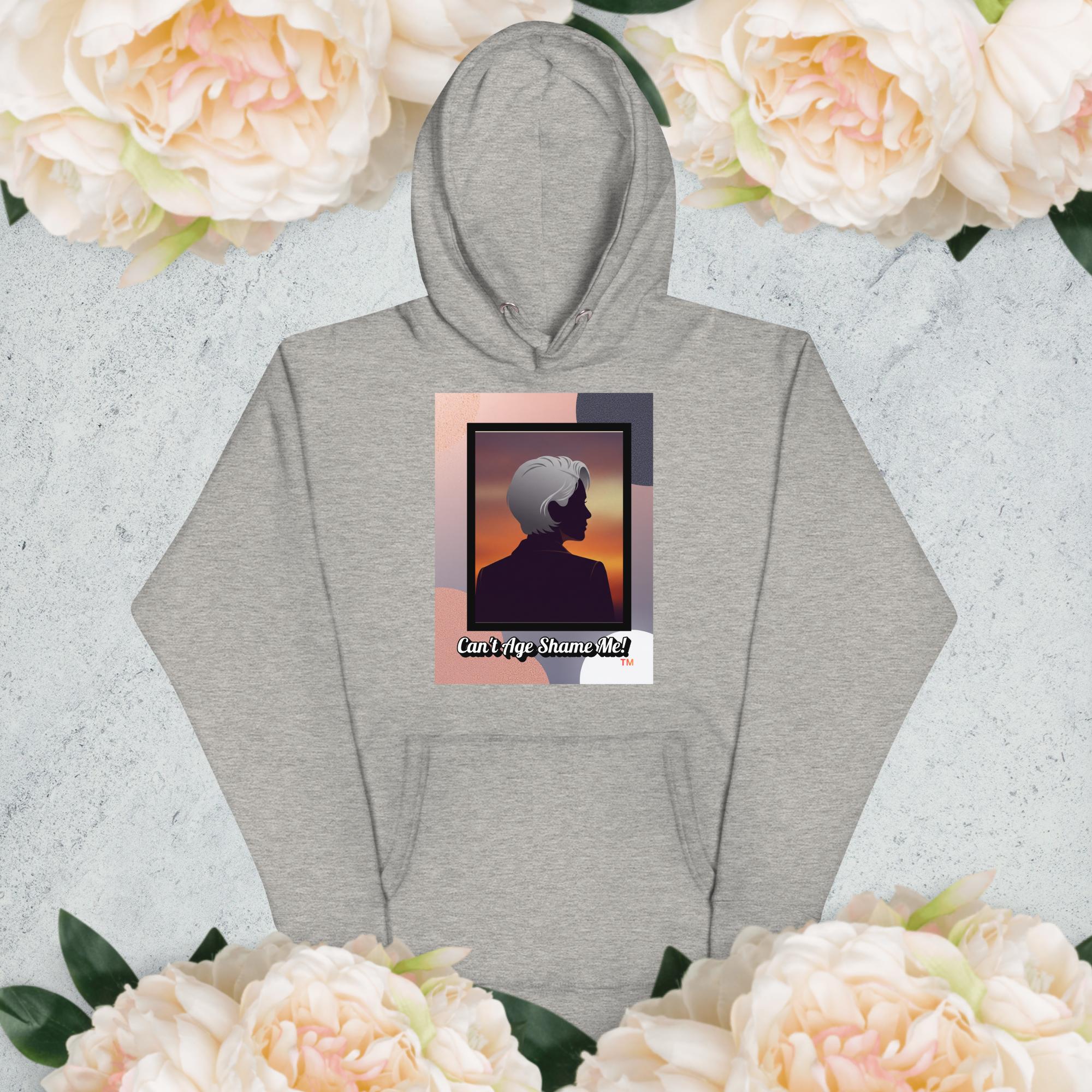 Gray hoodie with a graphic design of a woman with gray hair on a light gray background with flowers

