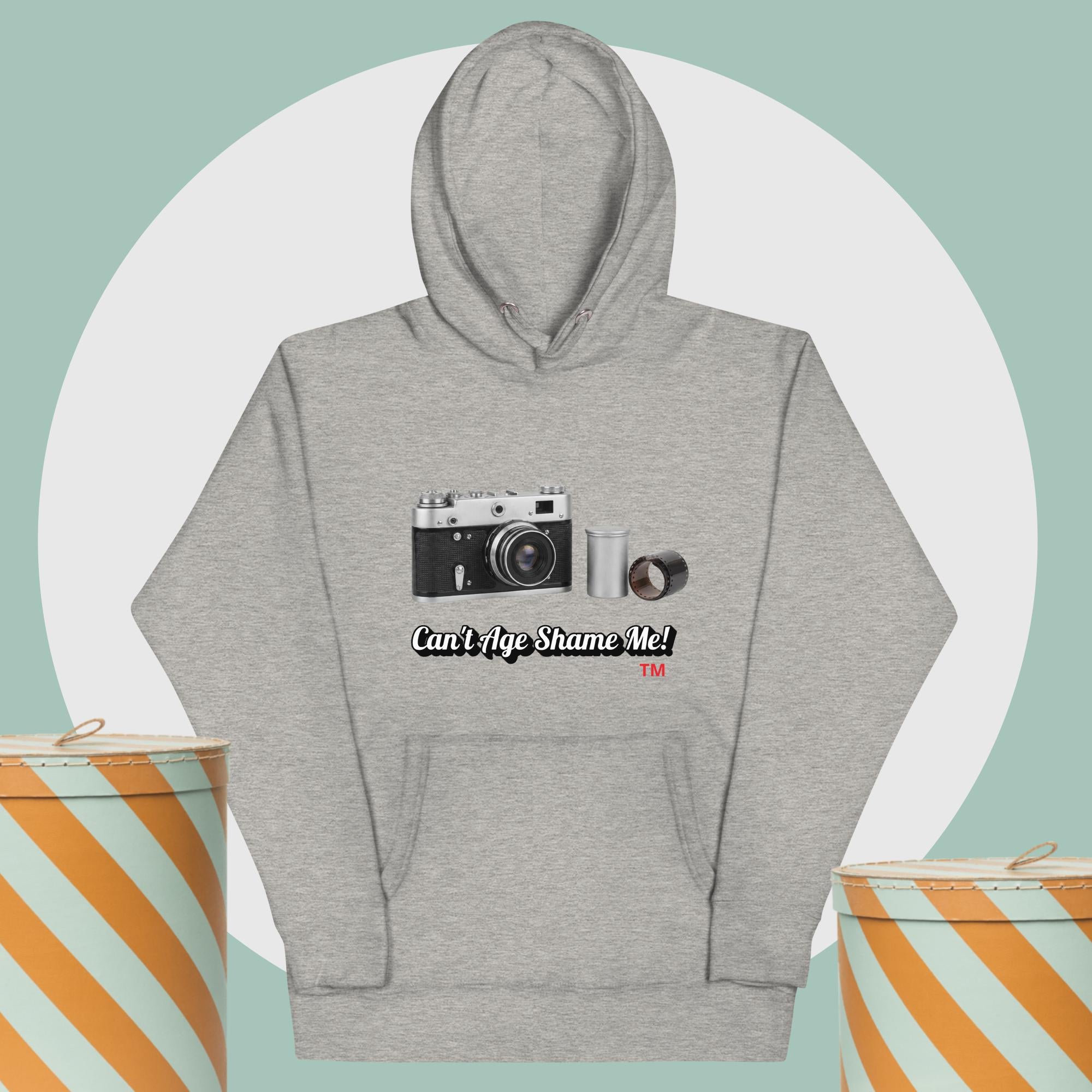 gray hoodie with camera graphic background two yellow and white hat boxes
