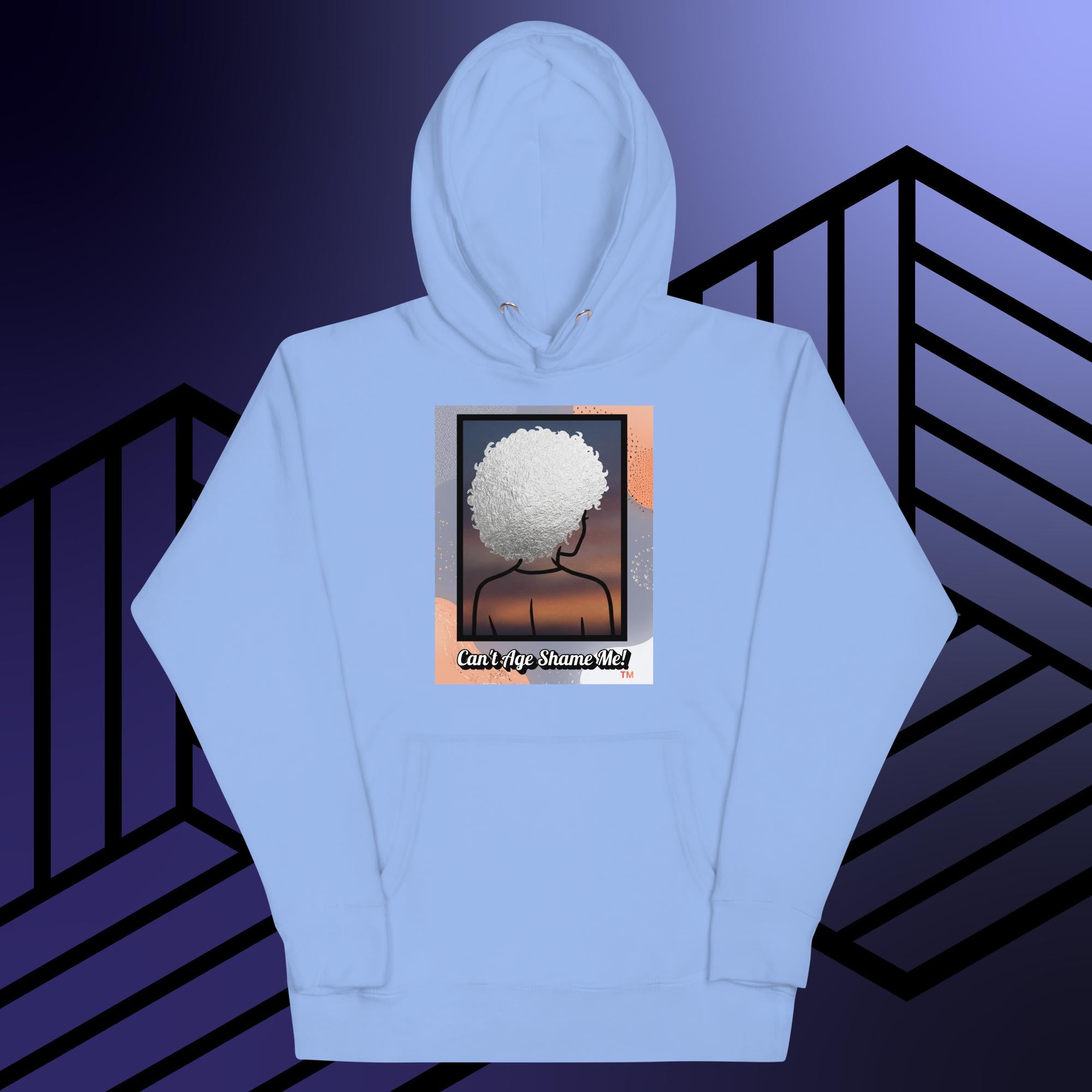 Light Blue hoodie with a graphic design of a person with textured hair and text 'Can't Age Shame Me!' on a colorful background.