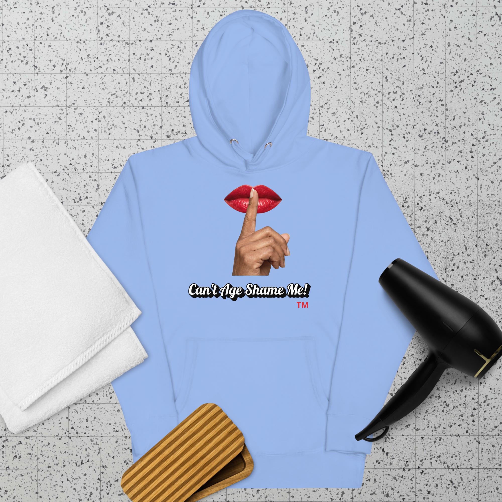 Carolina Blue hoodie with a graphic design of lips and a finger on a textured surface