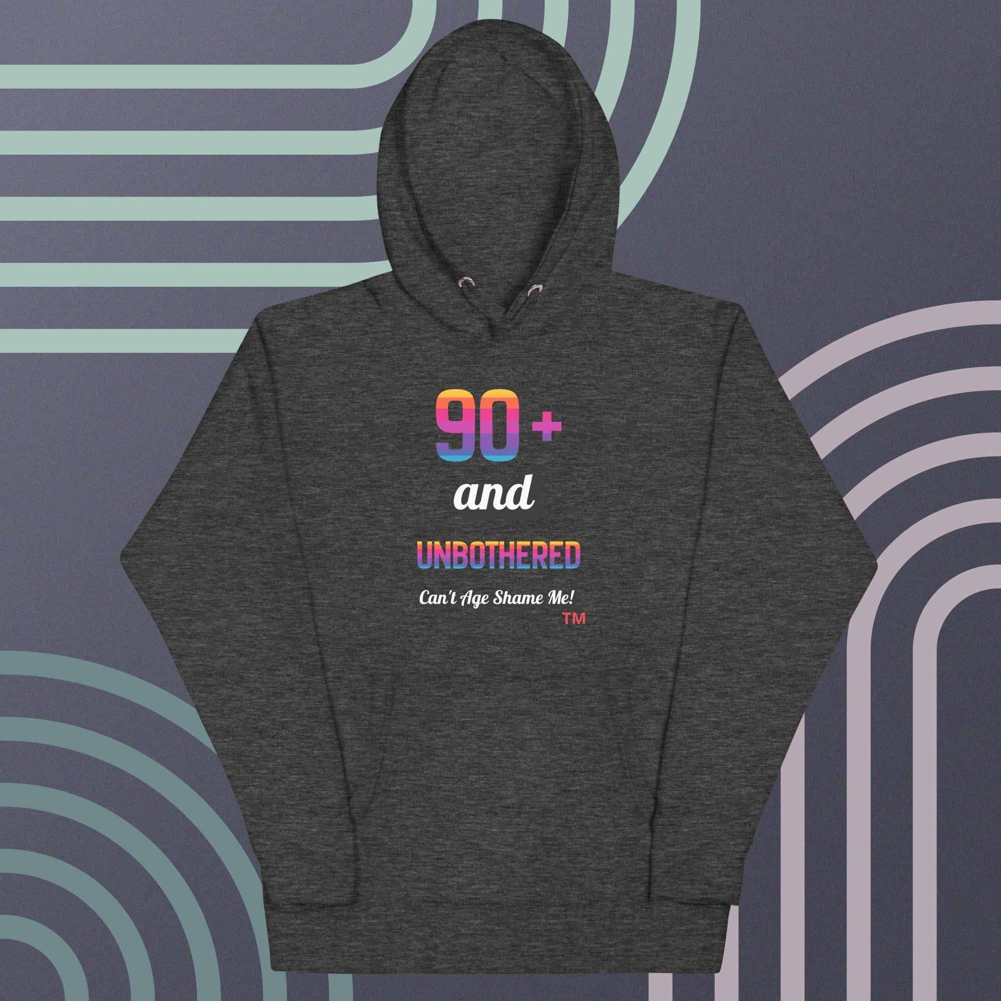 Dark gray hoodie with colorful text design on a patterned background