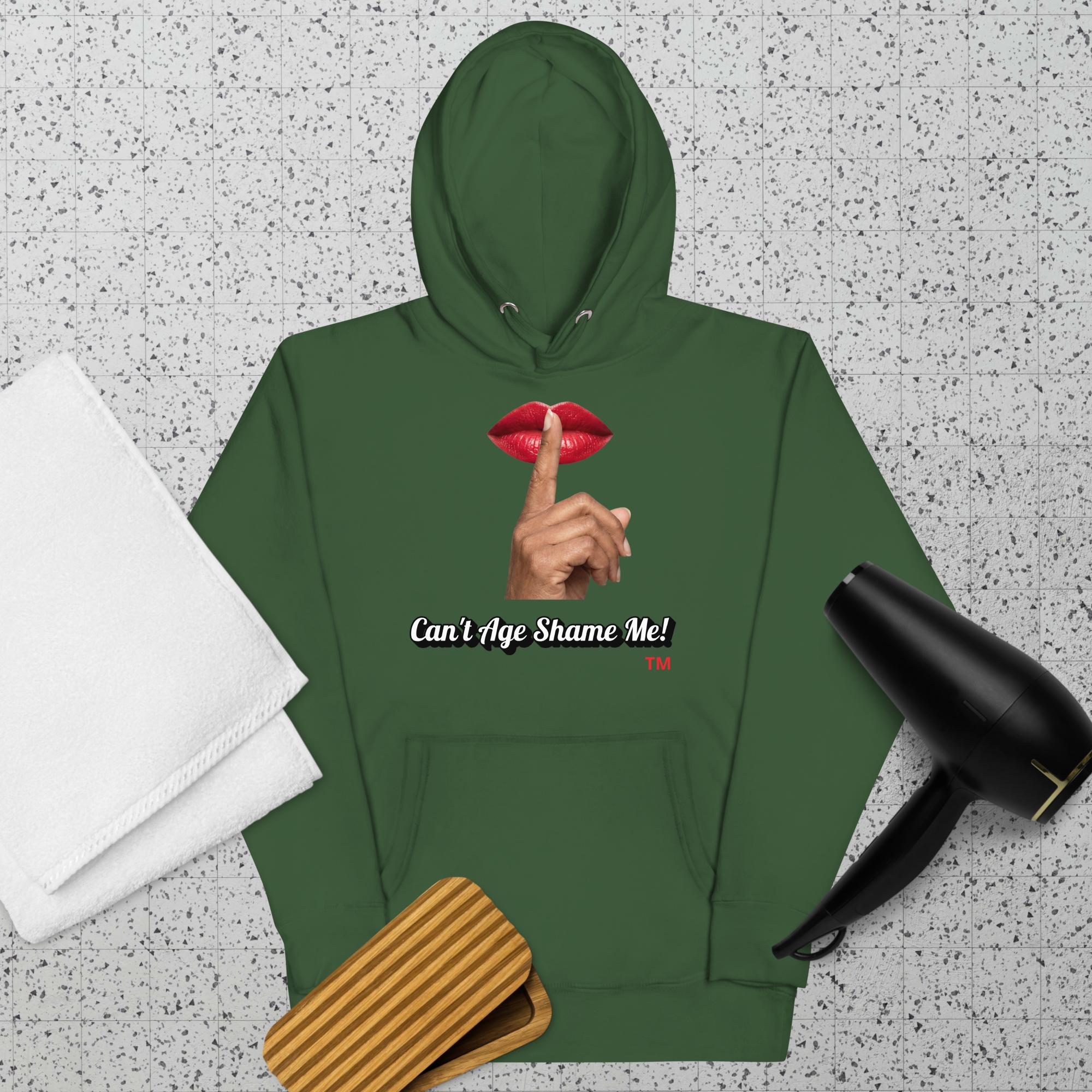 Forest Green hoodie with a graphic design of lips and a finger on a textured surface