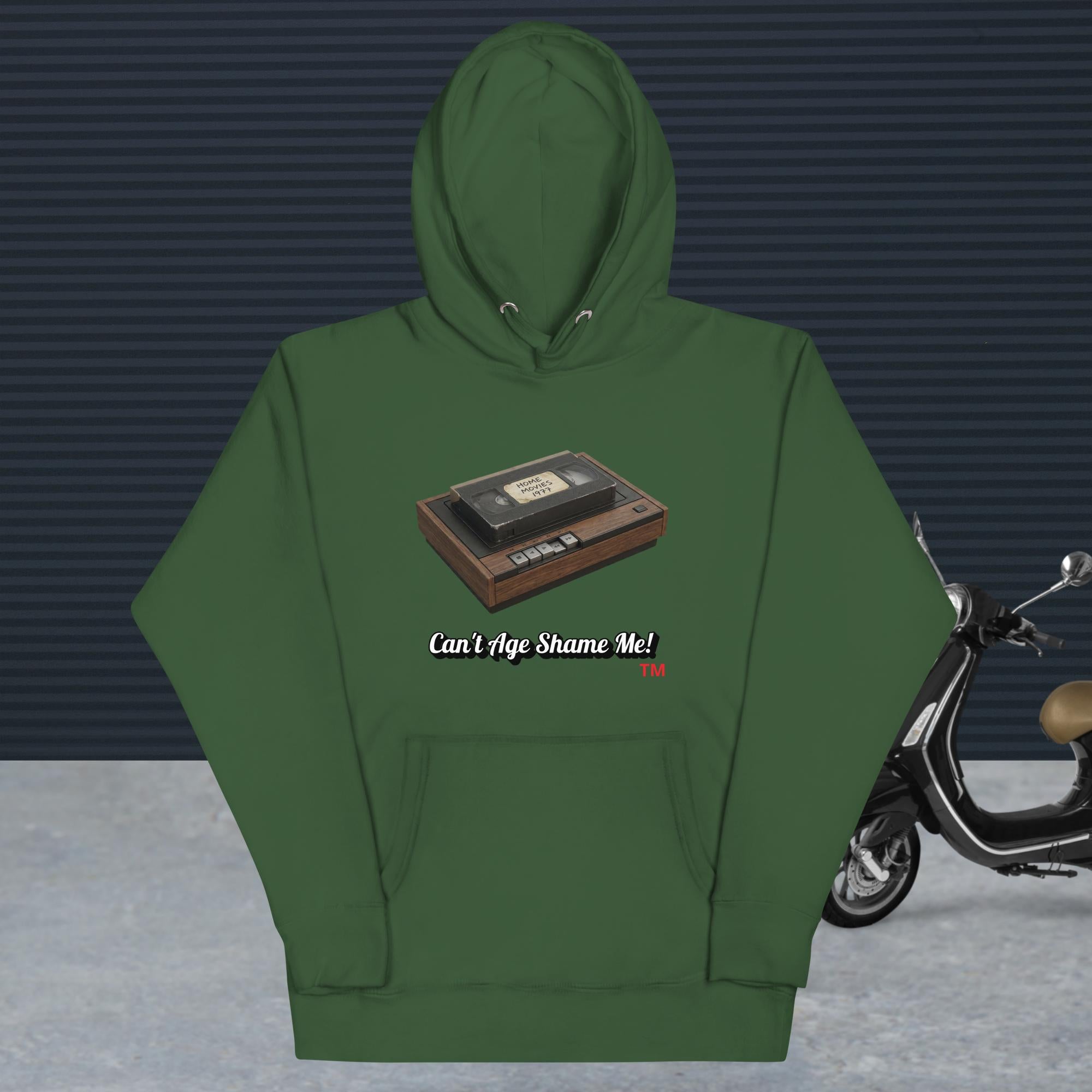green hoodie with a design of vhs recorder and tape