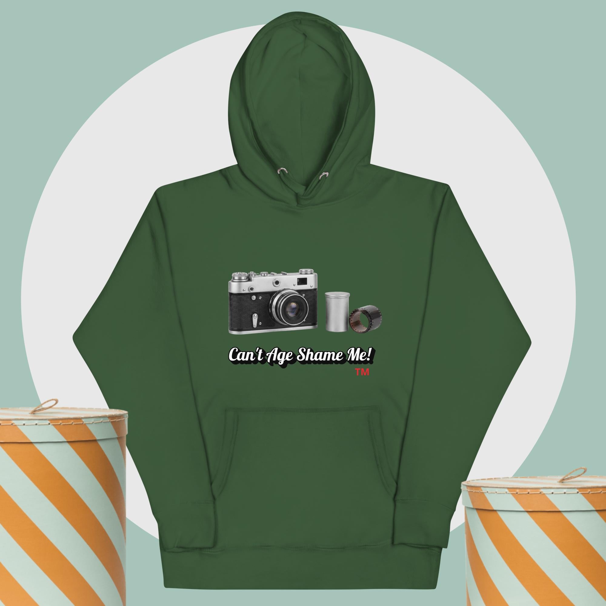 dark green hoodie with camera graphic background two yellow and white hat boxes