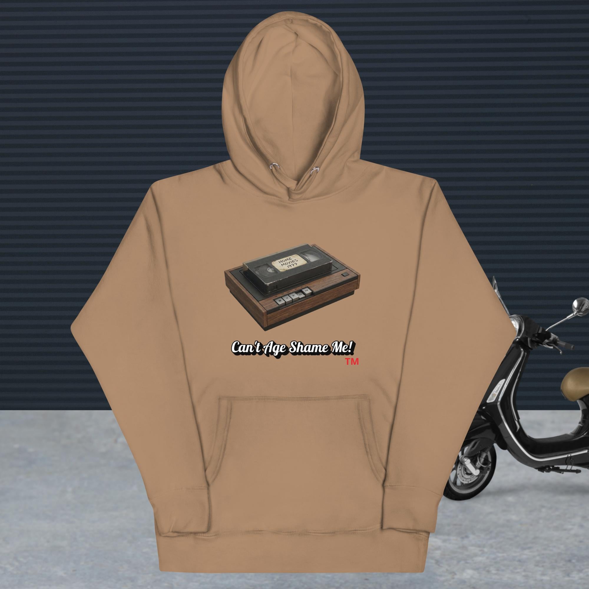 latte hoodie with a design of vhs recorder and tape