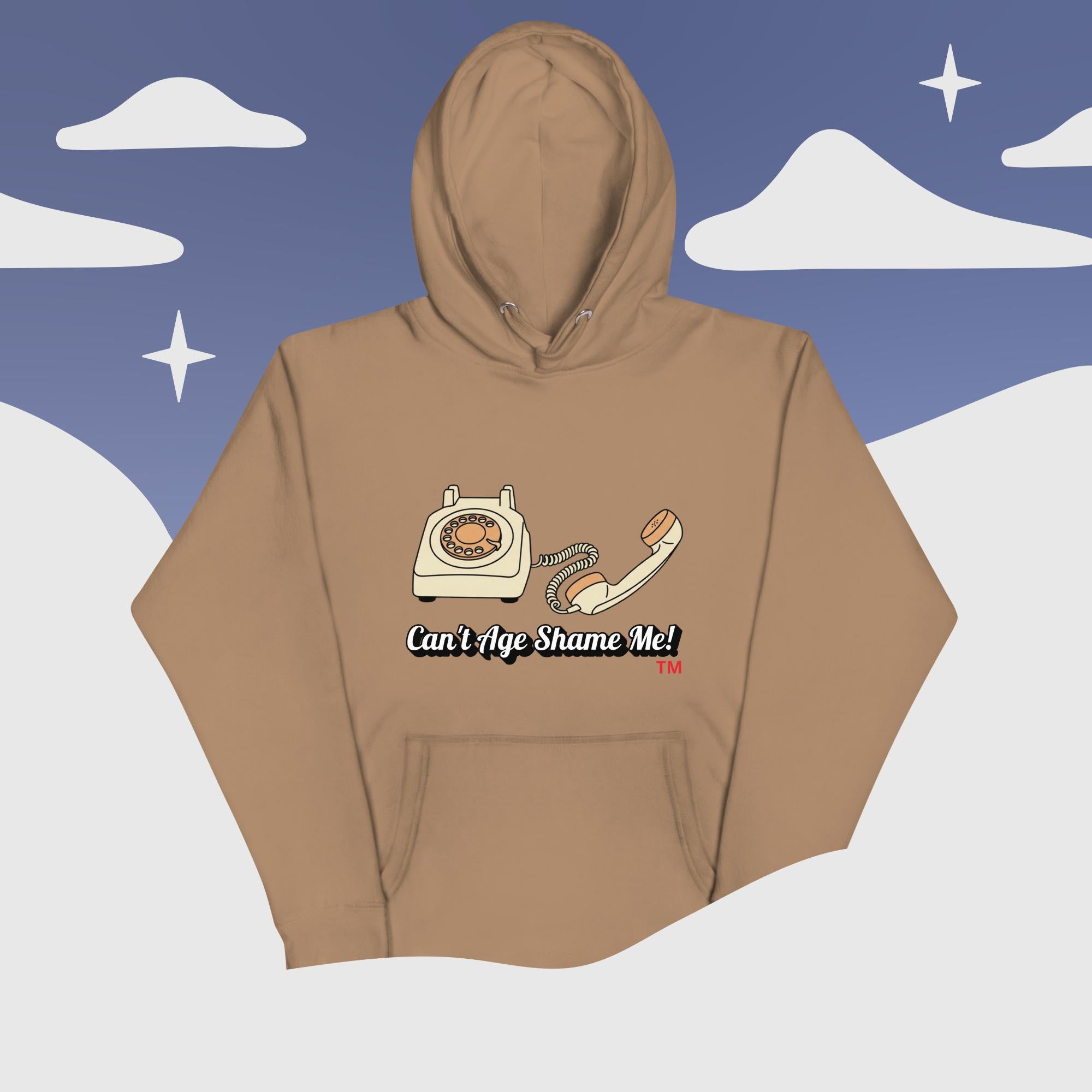 latte  hoodie with phone graphic and text 'Can't Age Shame Me' on a snowy landscape background
