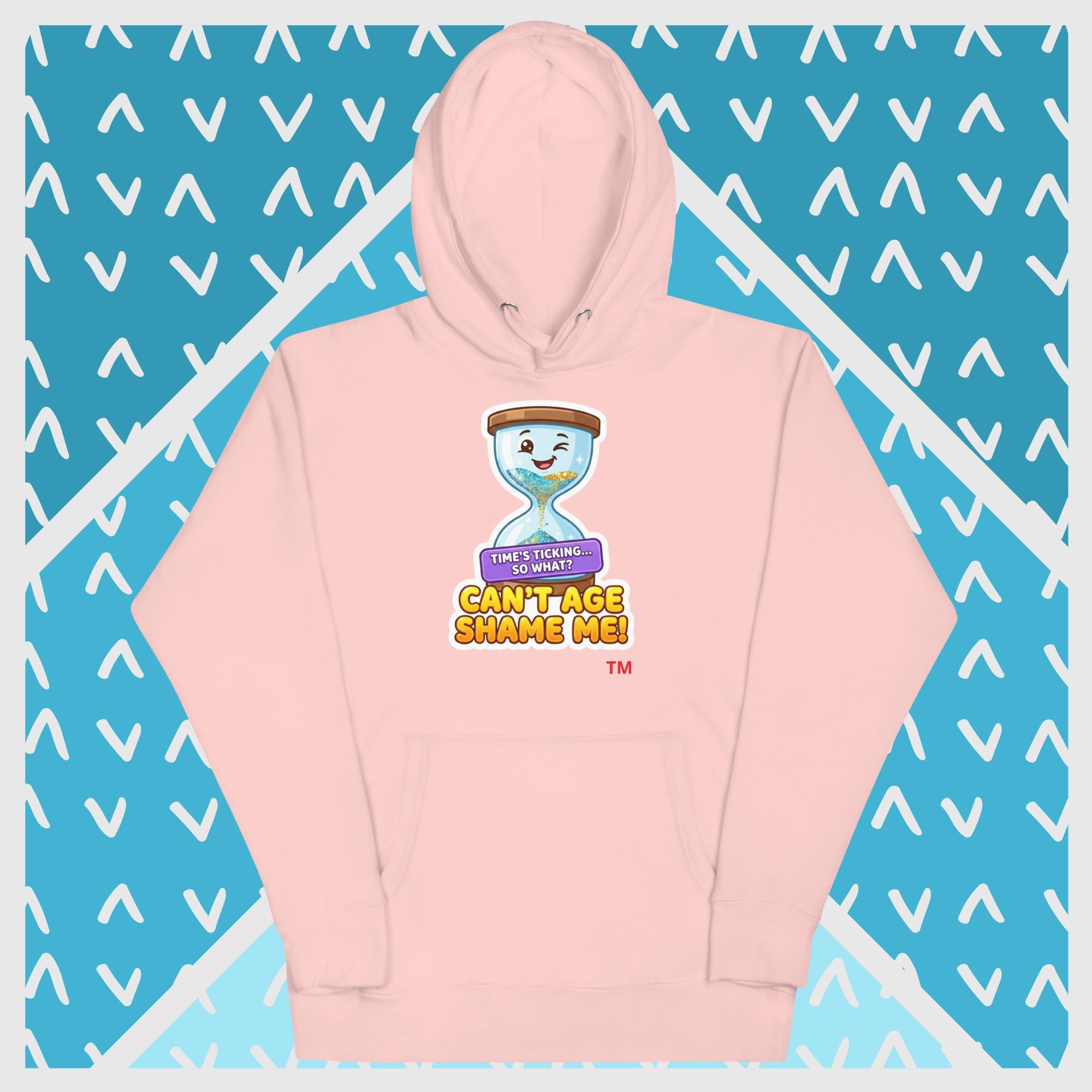 Light Pink hoodie with a hour glass design on a blue background with white geometric patterns 
