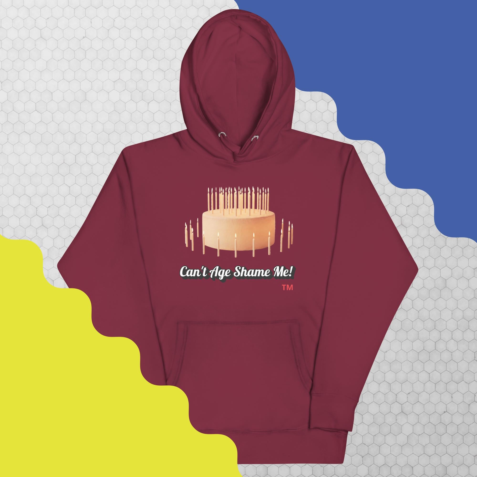 Maroon hoodie with birthday cake graphic and text on a colorful background