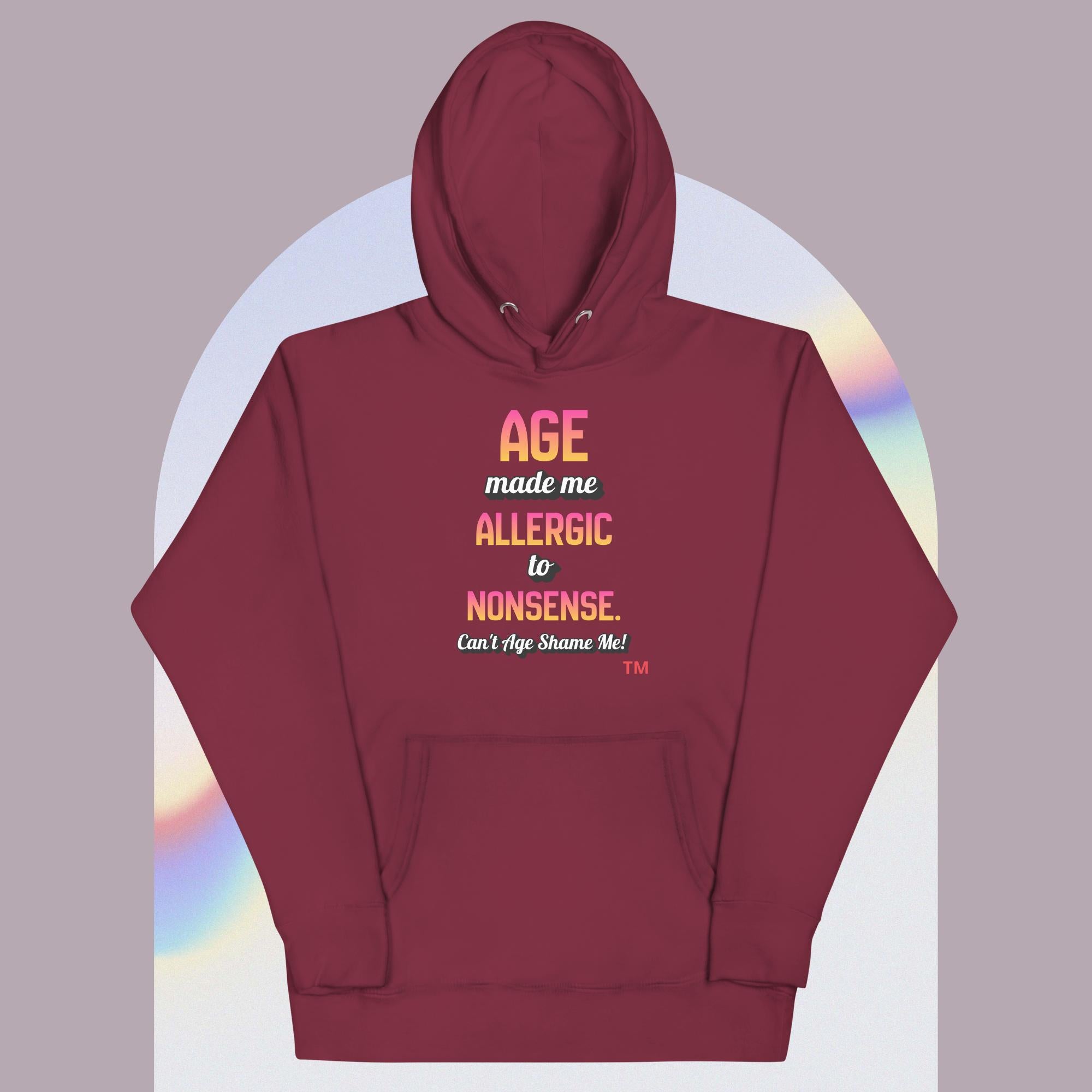Maroon hoodie with colorful text on a gradient background