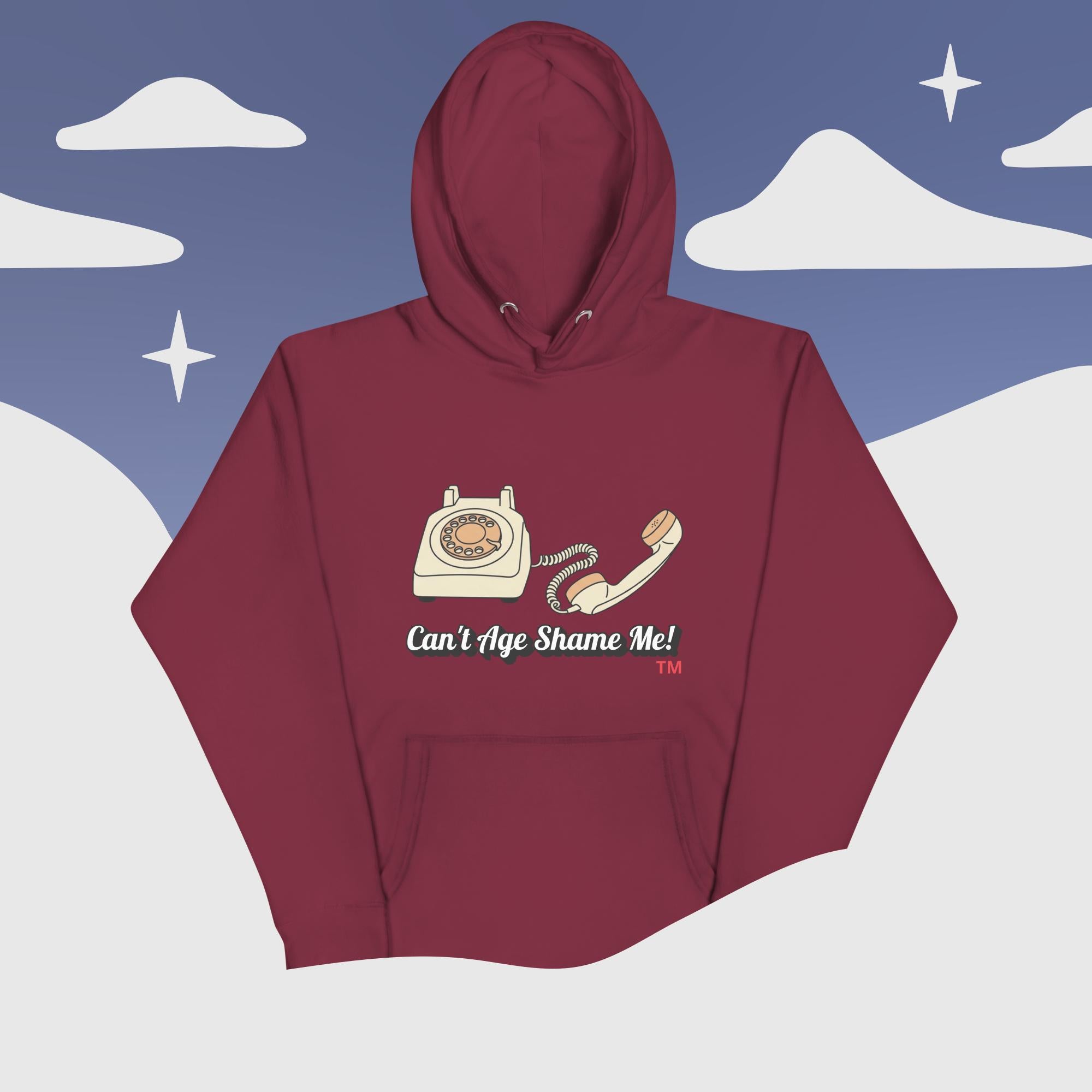 Maroon hoodie with phone graphic and text 'Can't Age Shame Me!' against a snowy mountain background