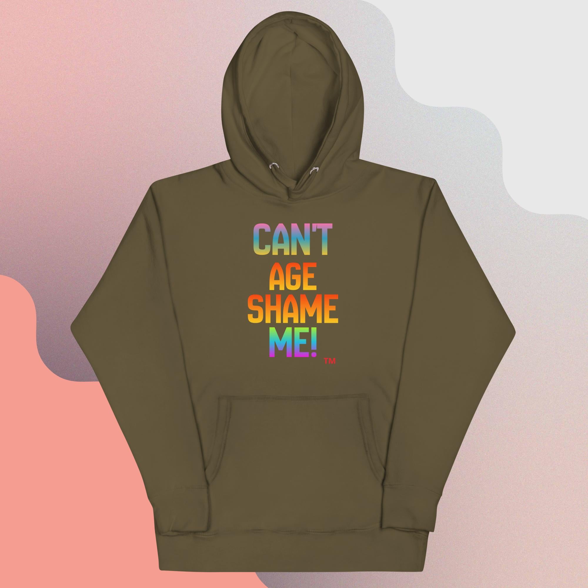 Green hoodie with colorful text 'CAN'T AGE SHAME ME!' on a gradient background