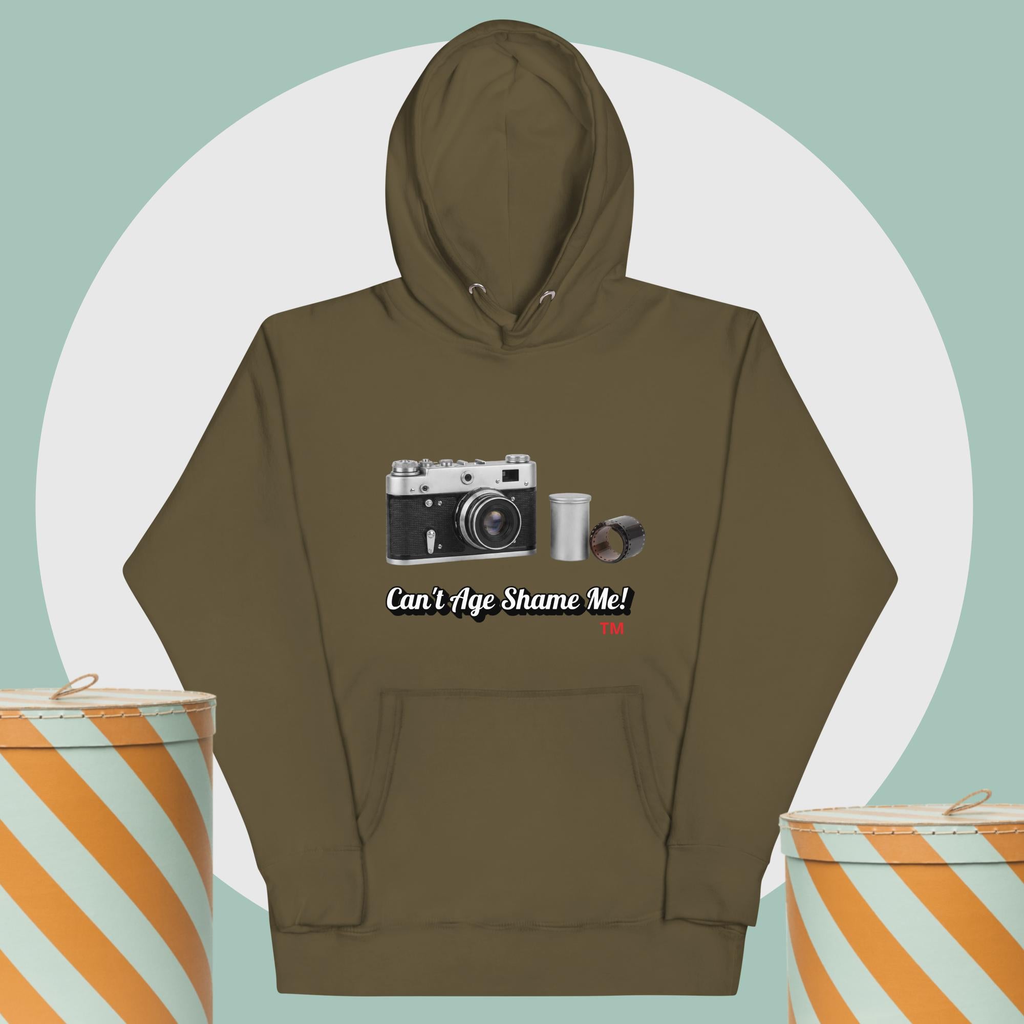green hoodie with camera graphic background two yellow and white hat boxes