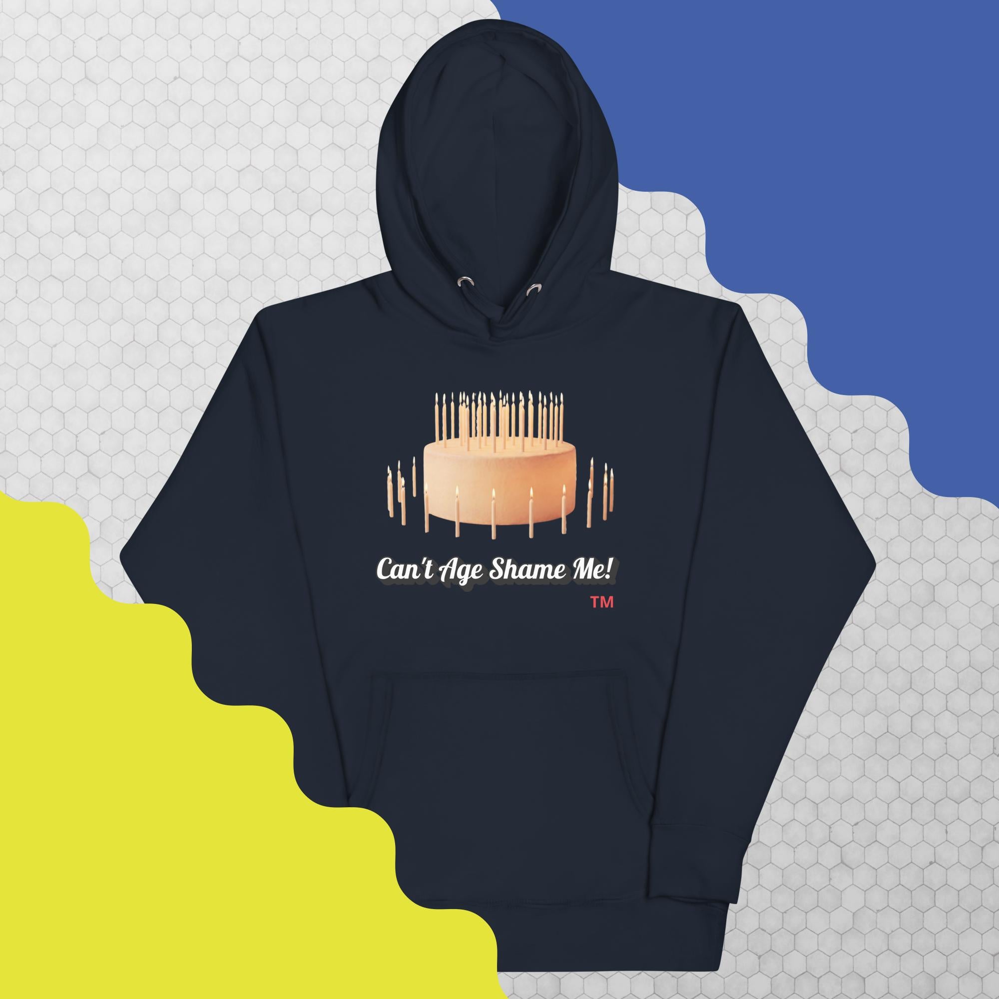 Navy blue hoodie with birthday cake graphic and text on a patterned background