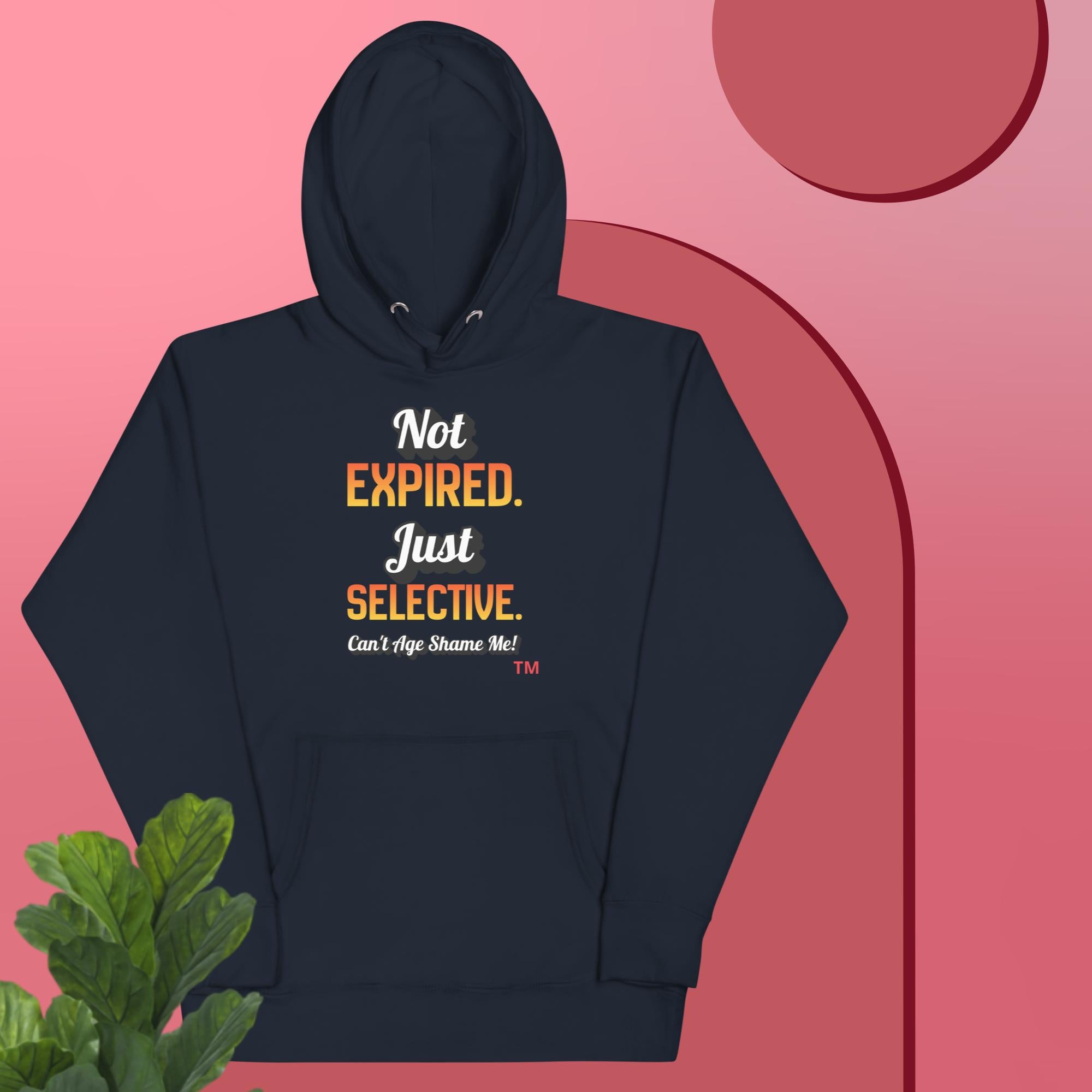 Navy hoodie with text on a pink background