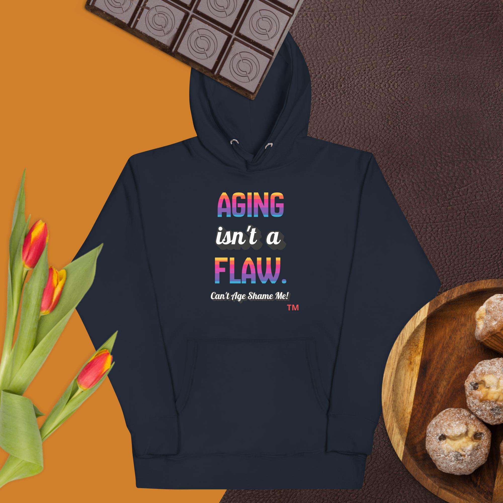 Navy blue hoodie with colorful text on a brown background with chocolate, tulips, and cookies.