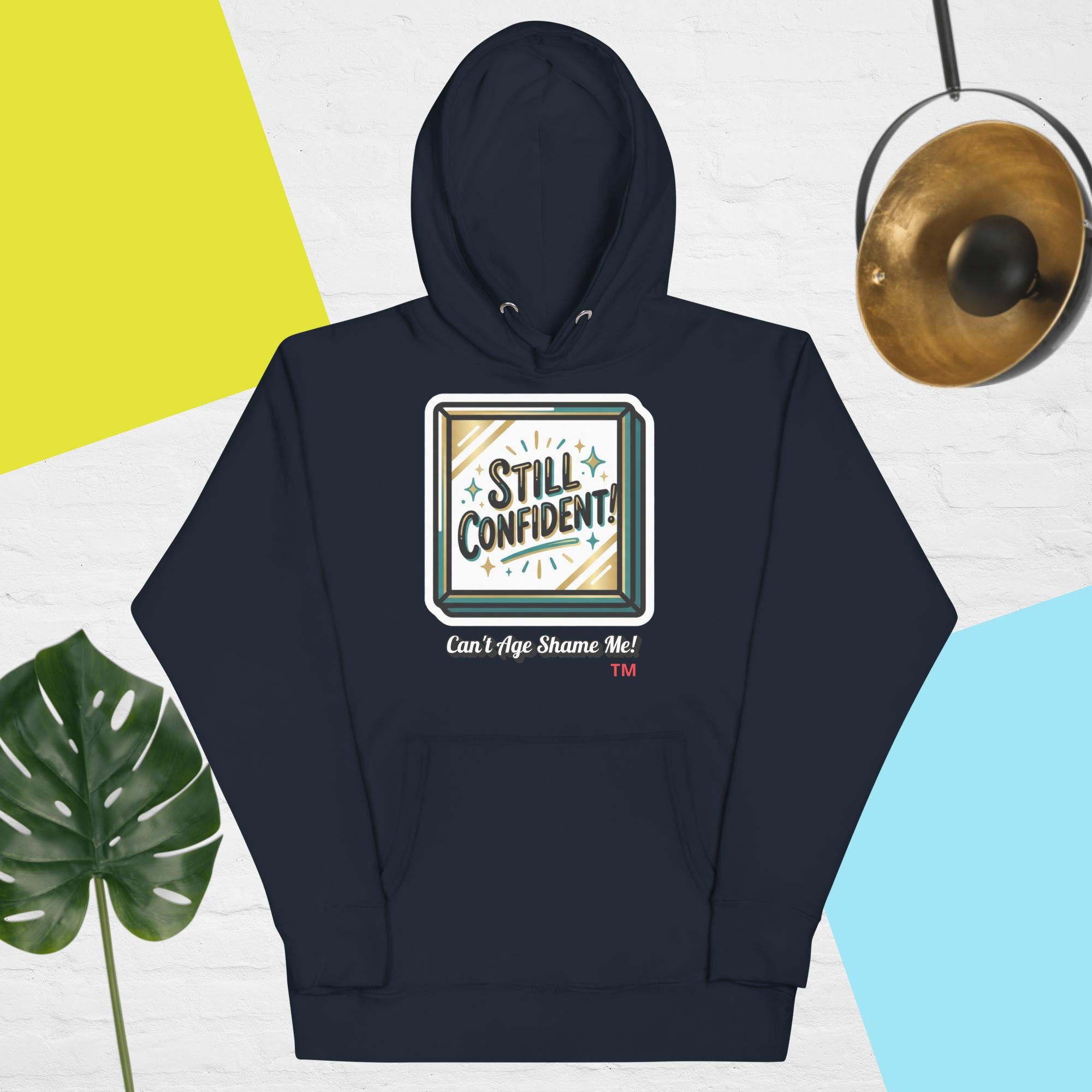 Navy blue hoodie with 'Still Confident' graphic on a colorful background