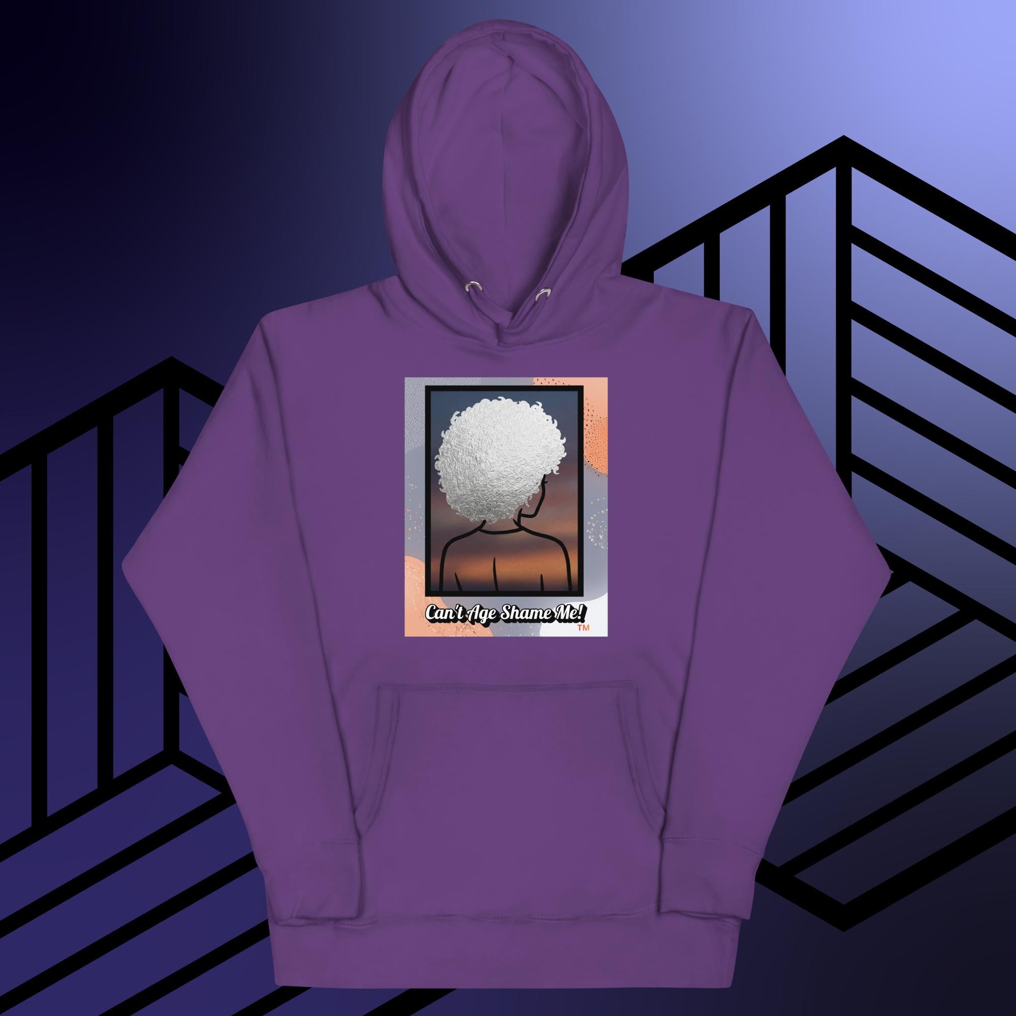 Purple hoodie with a graphic design of a person with textured hair and text 'Can't Age Shame Me!' on a colorful background.


