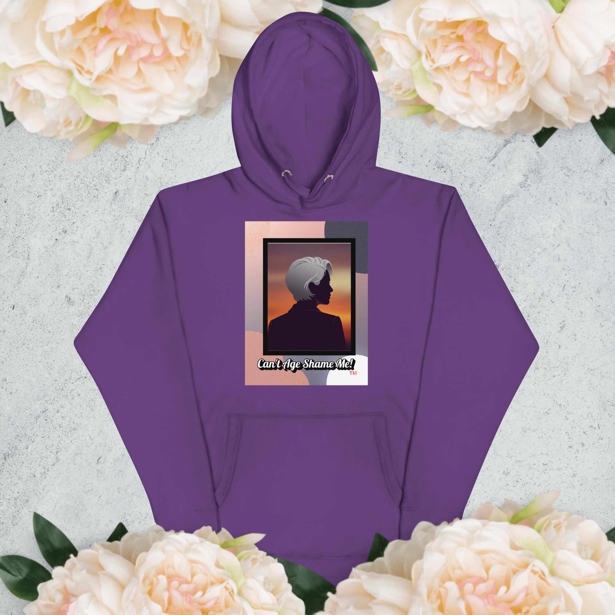 Purple hoodie with a graphic design of a woman with gray hair on a light gray background with flowers

