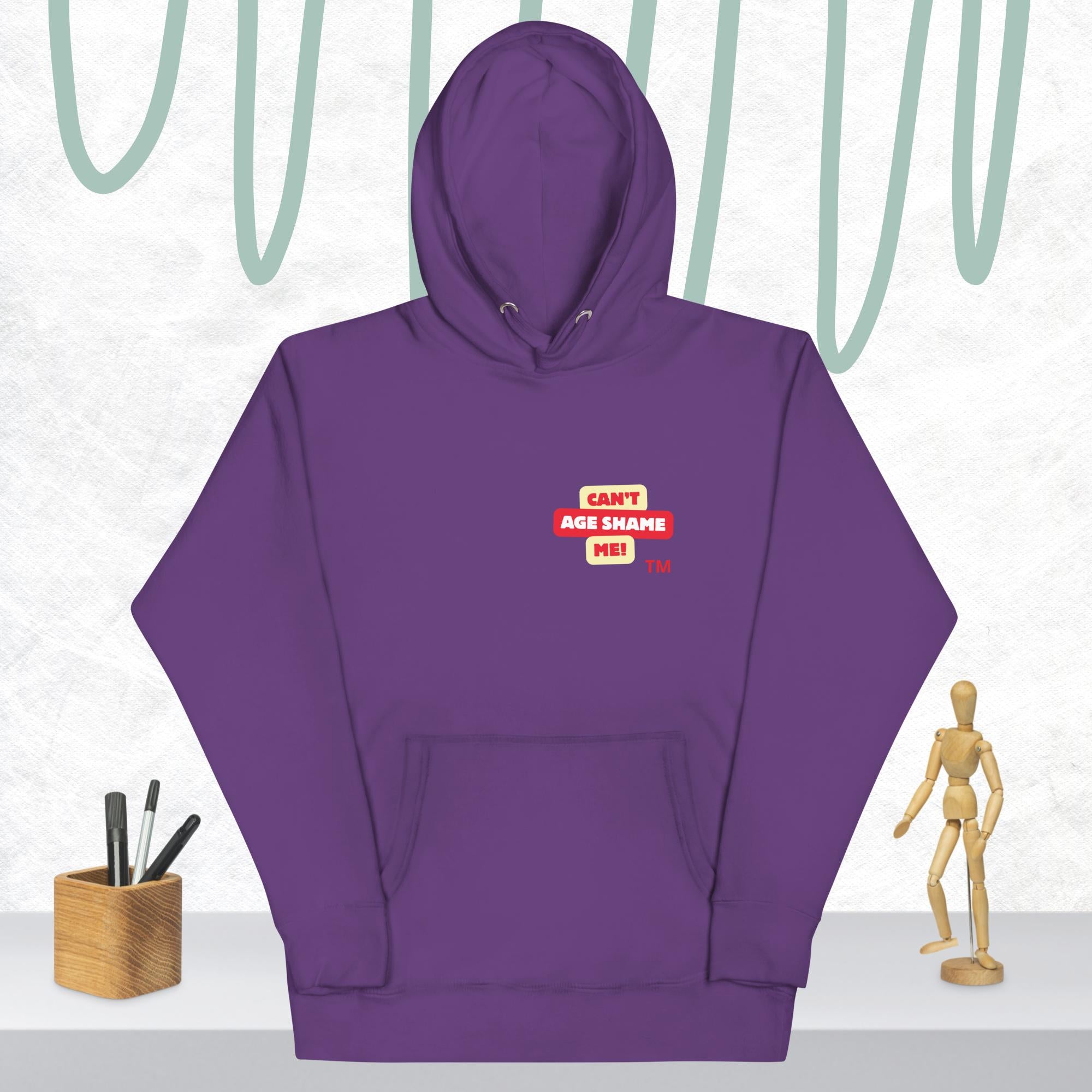 Purple hoodie with a red and white logo text 'CAN'T AGE SHAME ME! on a light gray background