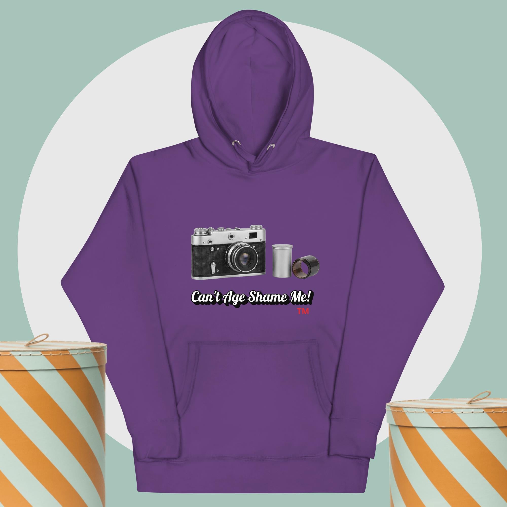 purple hoodie with camera graphic background two yellow and white hat boxes