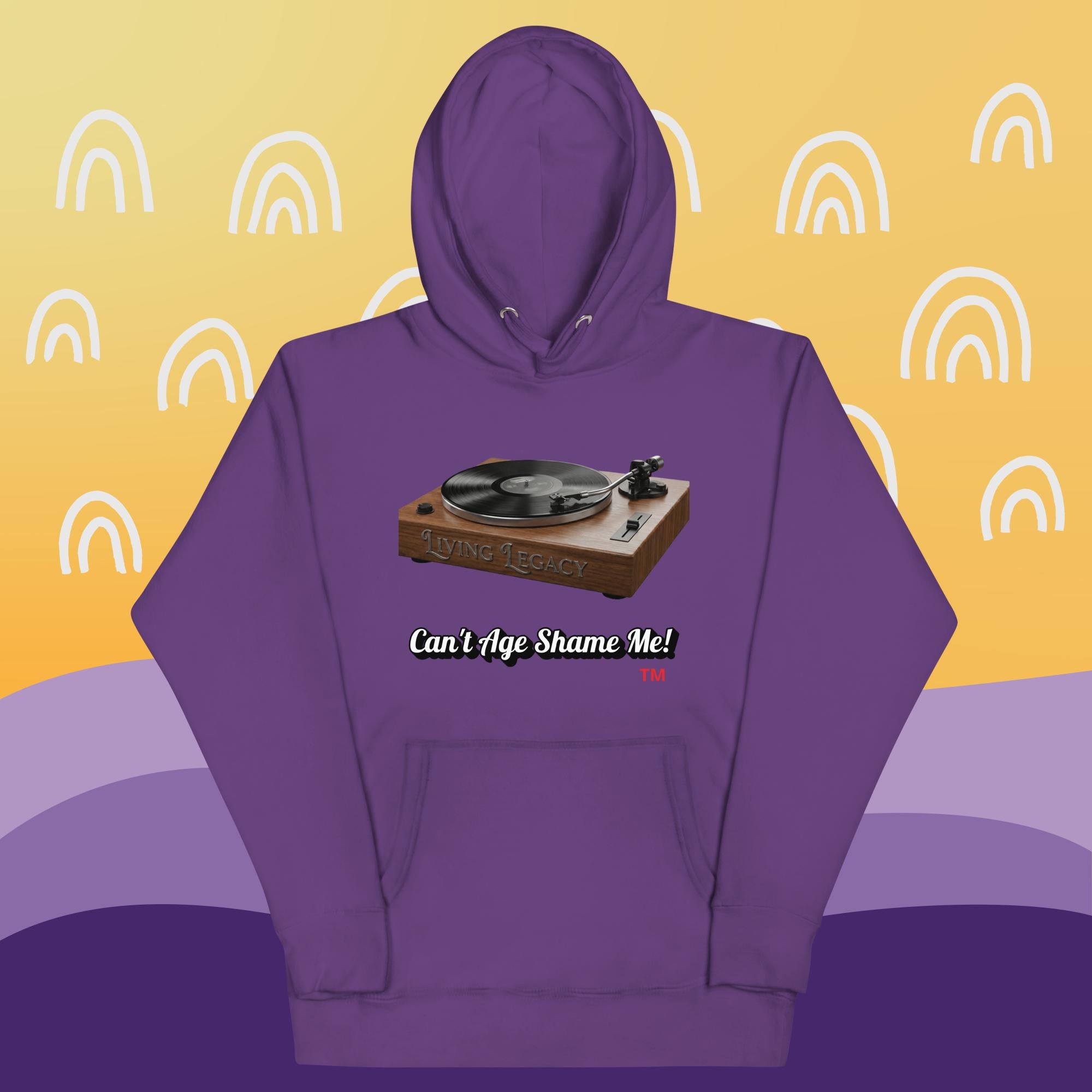 purple  hoodie with a graphic of a turntable and text can't age shame me! on a yellow and purple background