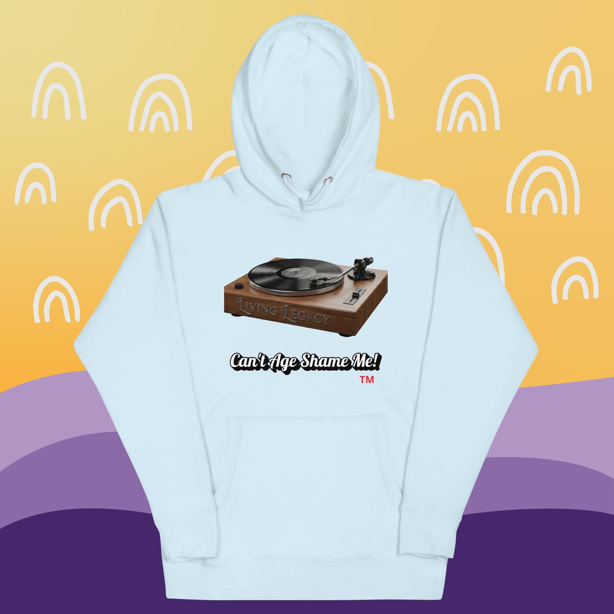 sky blue hoodie with a graphic of a turntable and text can't age shame me! on a yellow and purple background