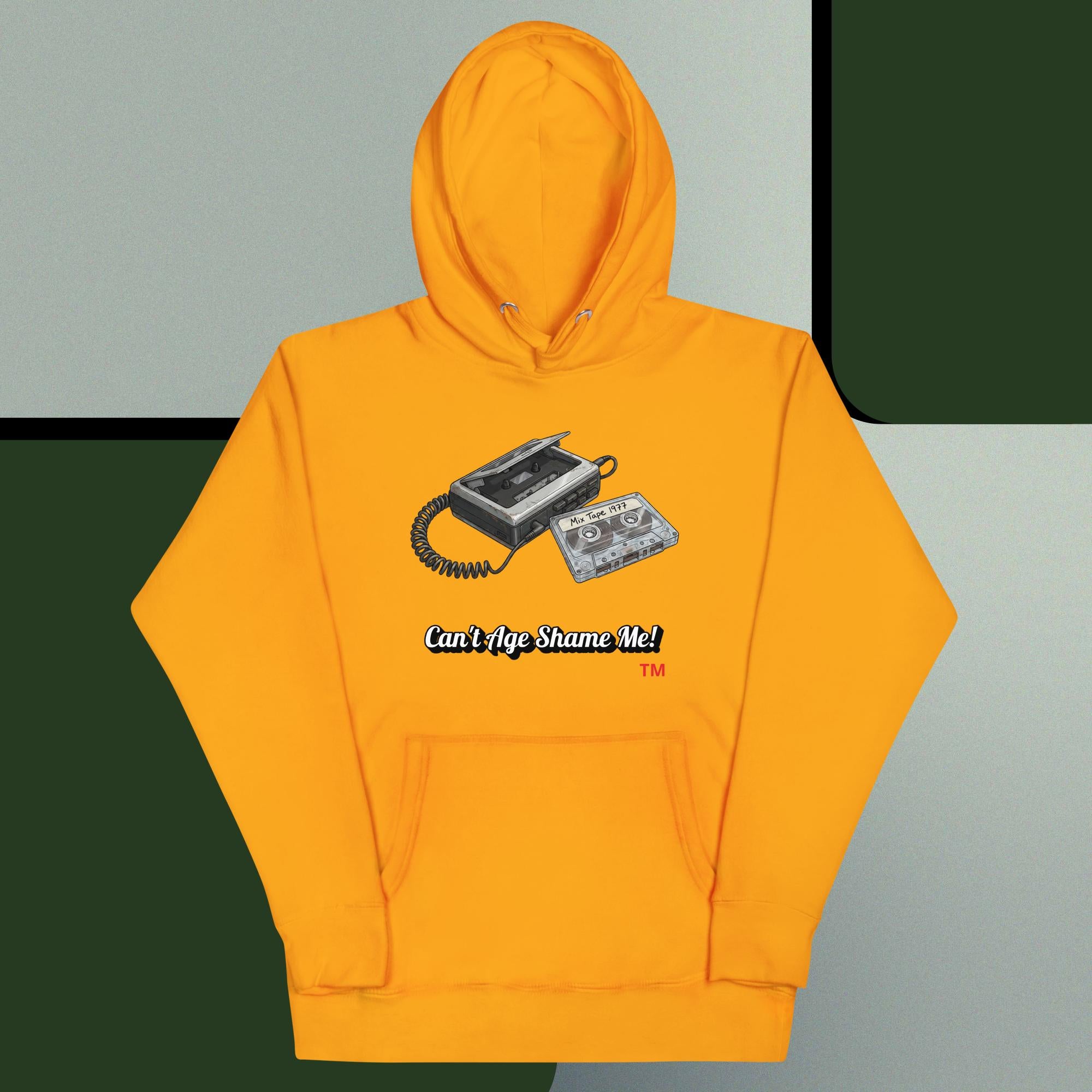 gold hoodie with a graphic design of a cassette tape on a gray and green background