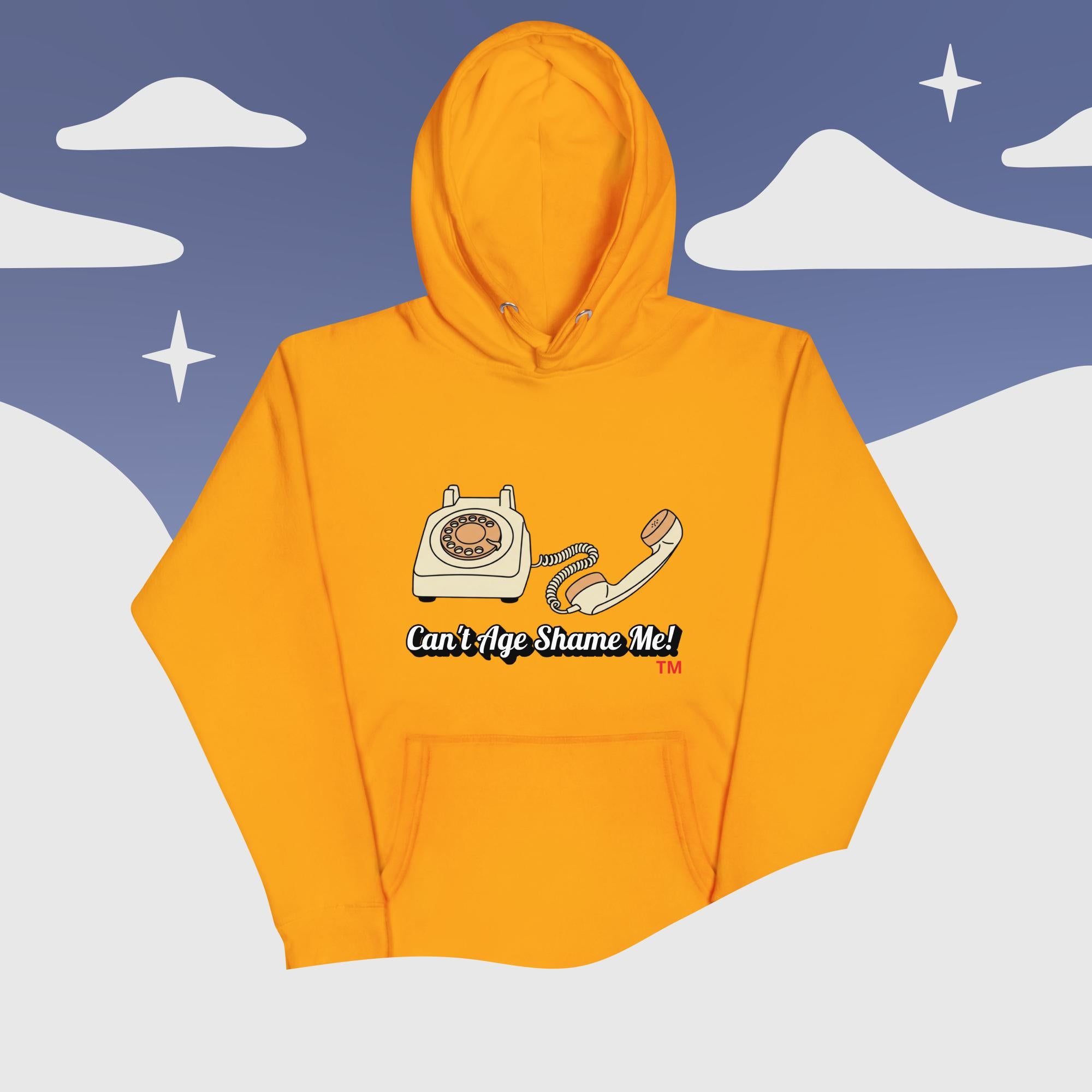 gold hoodie with a graphic design of an old telephone and text on a snowy mountain background