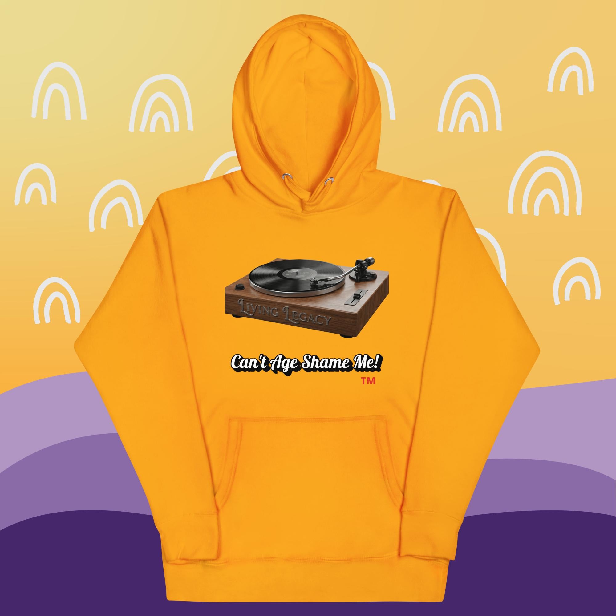 gold hoodie with a graphic of a turntable and text can't age shame me! on a yellow and purple background