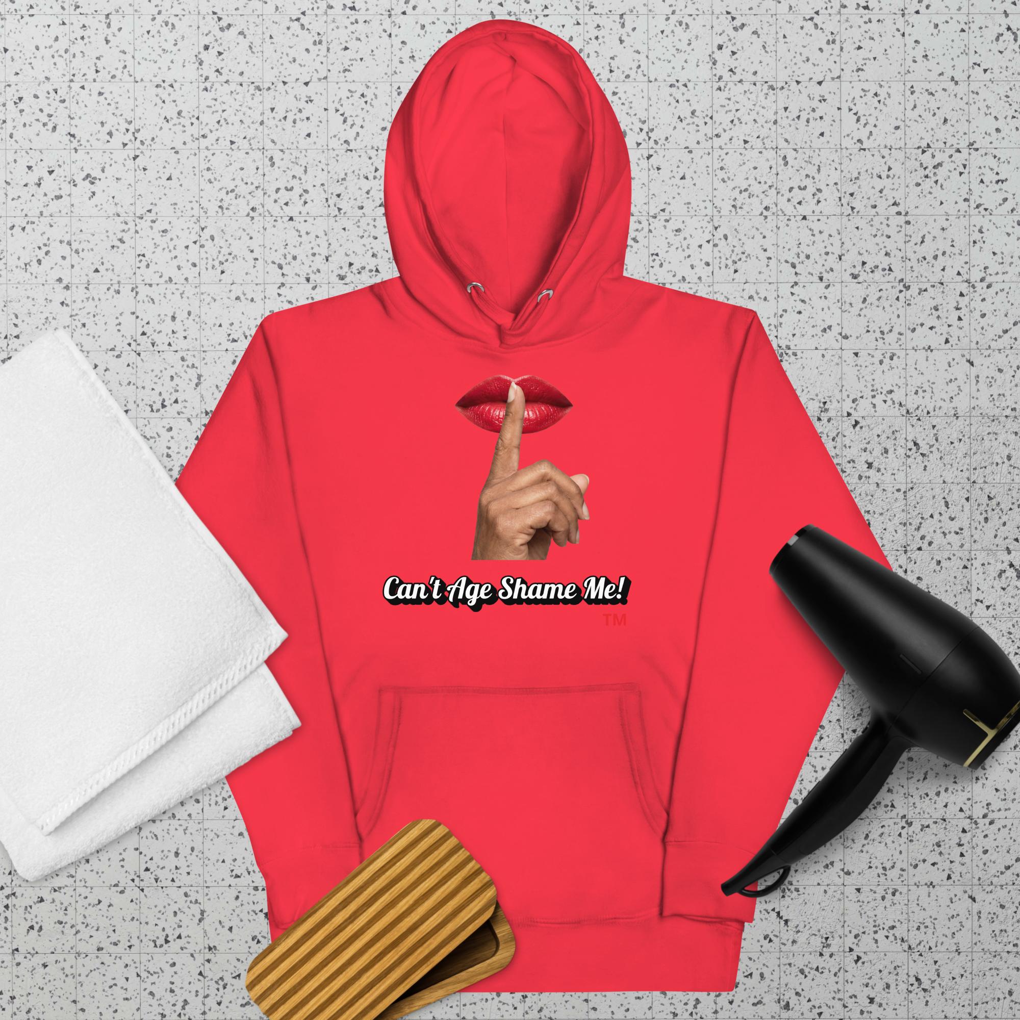 Team Red hoodie with a graphic design of lips and a finger on a textured surface