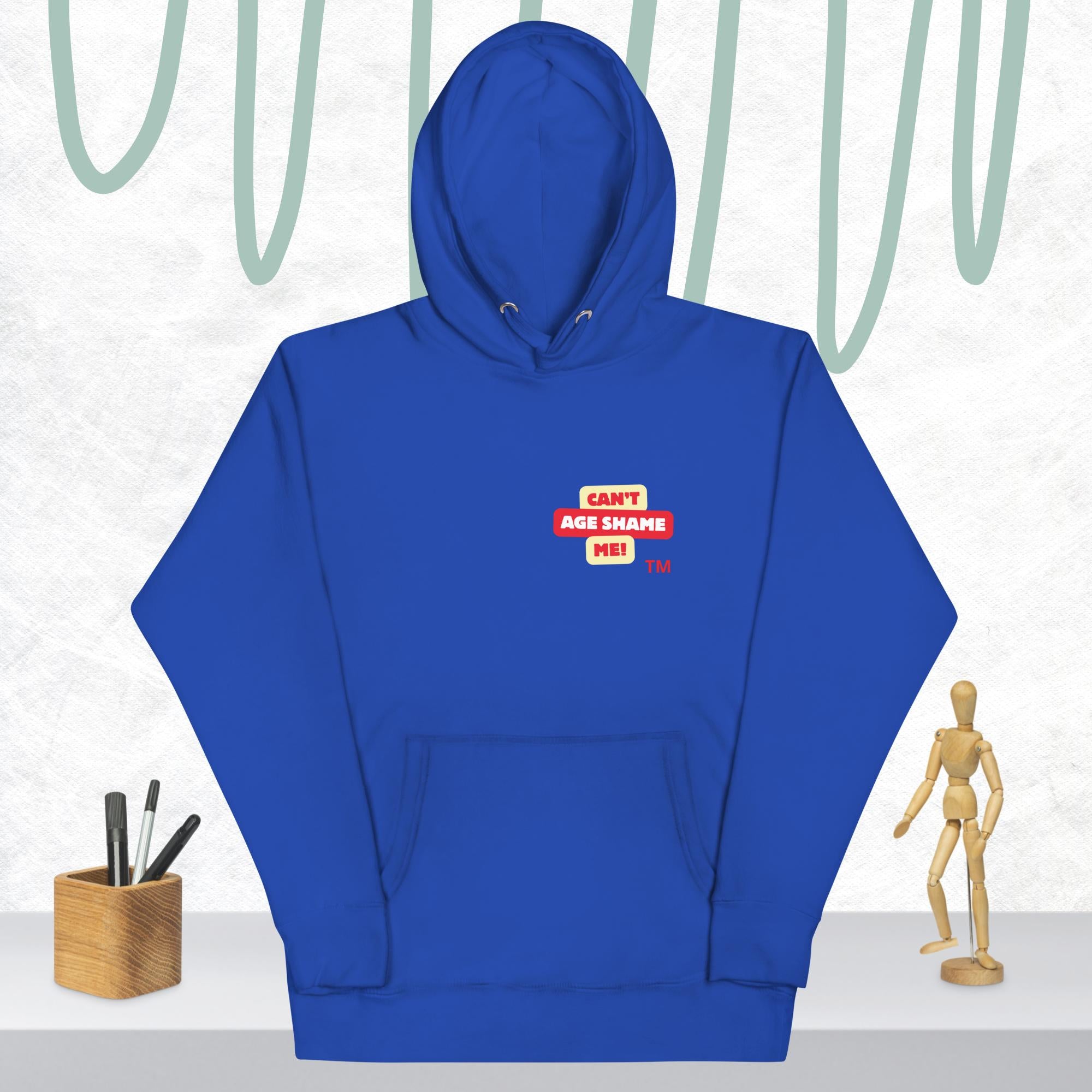 Team royal hoodie with a red and white logo text 'CAN'T AGE SHAME ME! on a light gray background