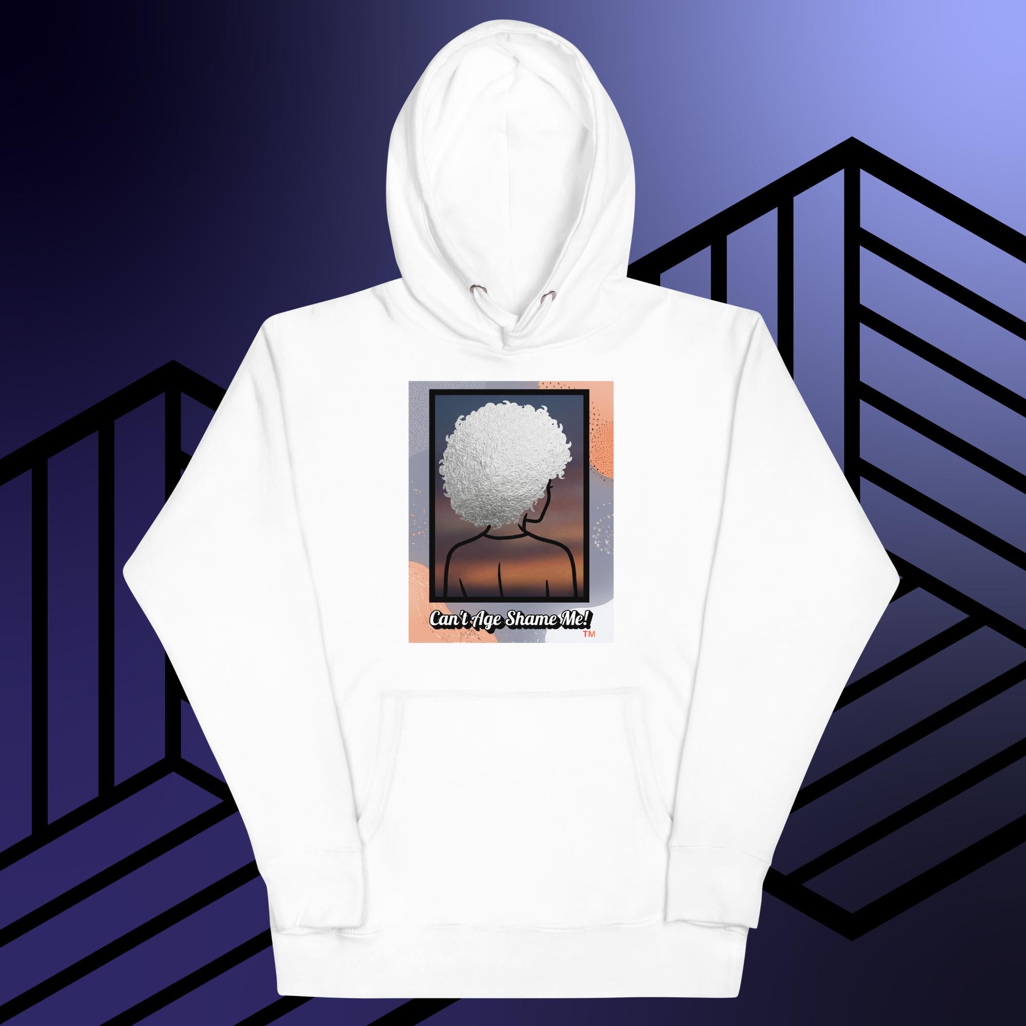 White hoodie with a graphic design of a person with textured hair and text 'Can't Age Shame Me!' on a colorful background.

