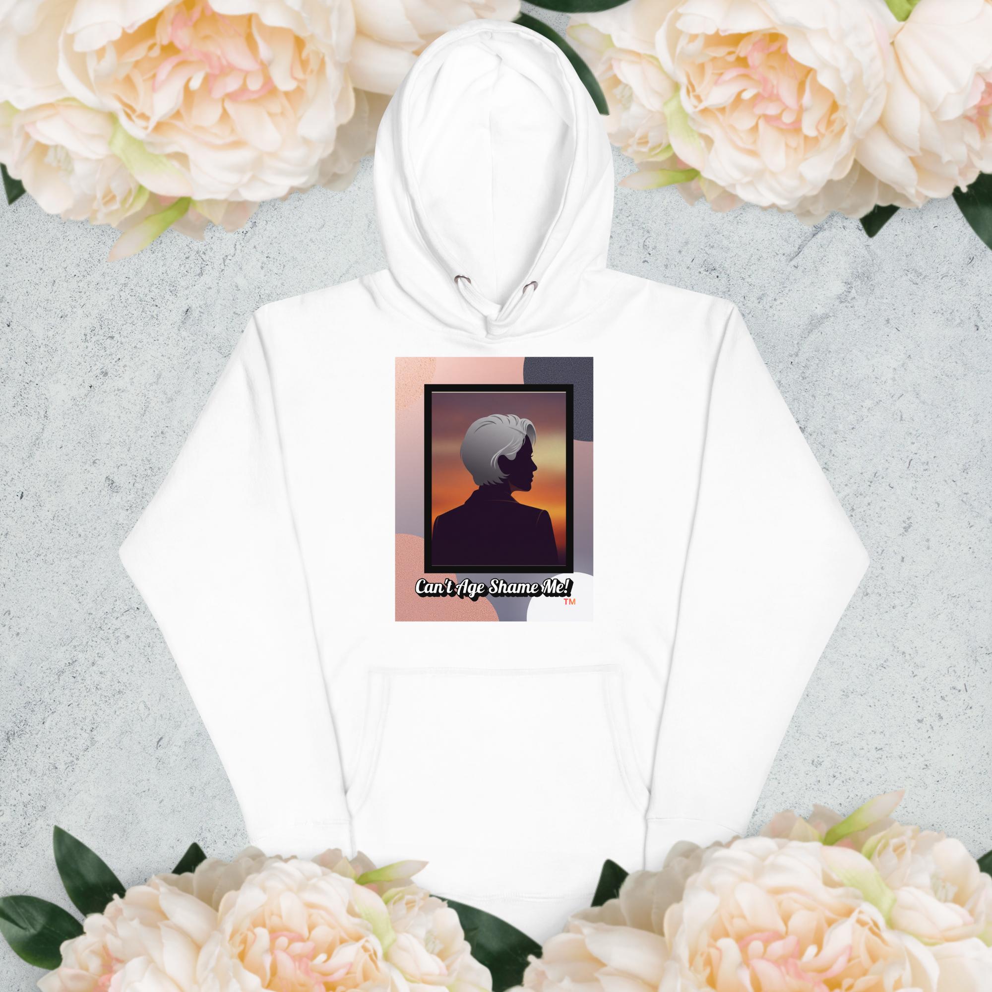 White hoodie with a graphic design of a woman with gray hair on a light gray background with flowers

