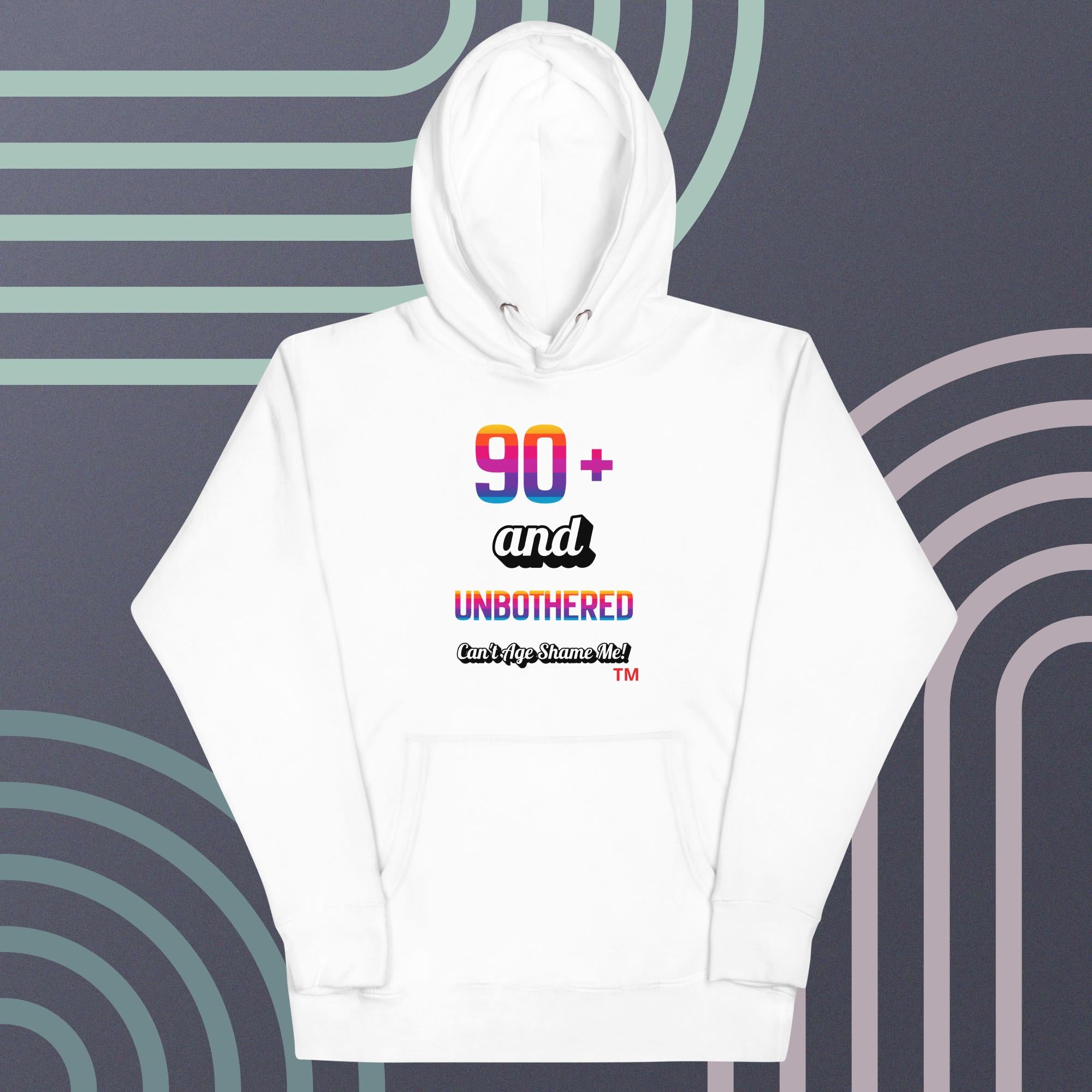 White hoodie with colorful text design on a patterned background