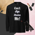 Black sweatshirt with 'Can't Age Shame Me!' text on a pink background with accessories.