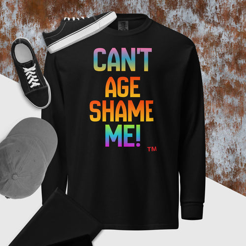 Black long-sleeve shirt with colorful text 'CAN'T AGE SHAME ME!' on a textured surface.