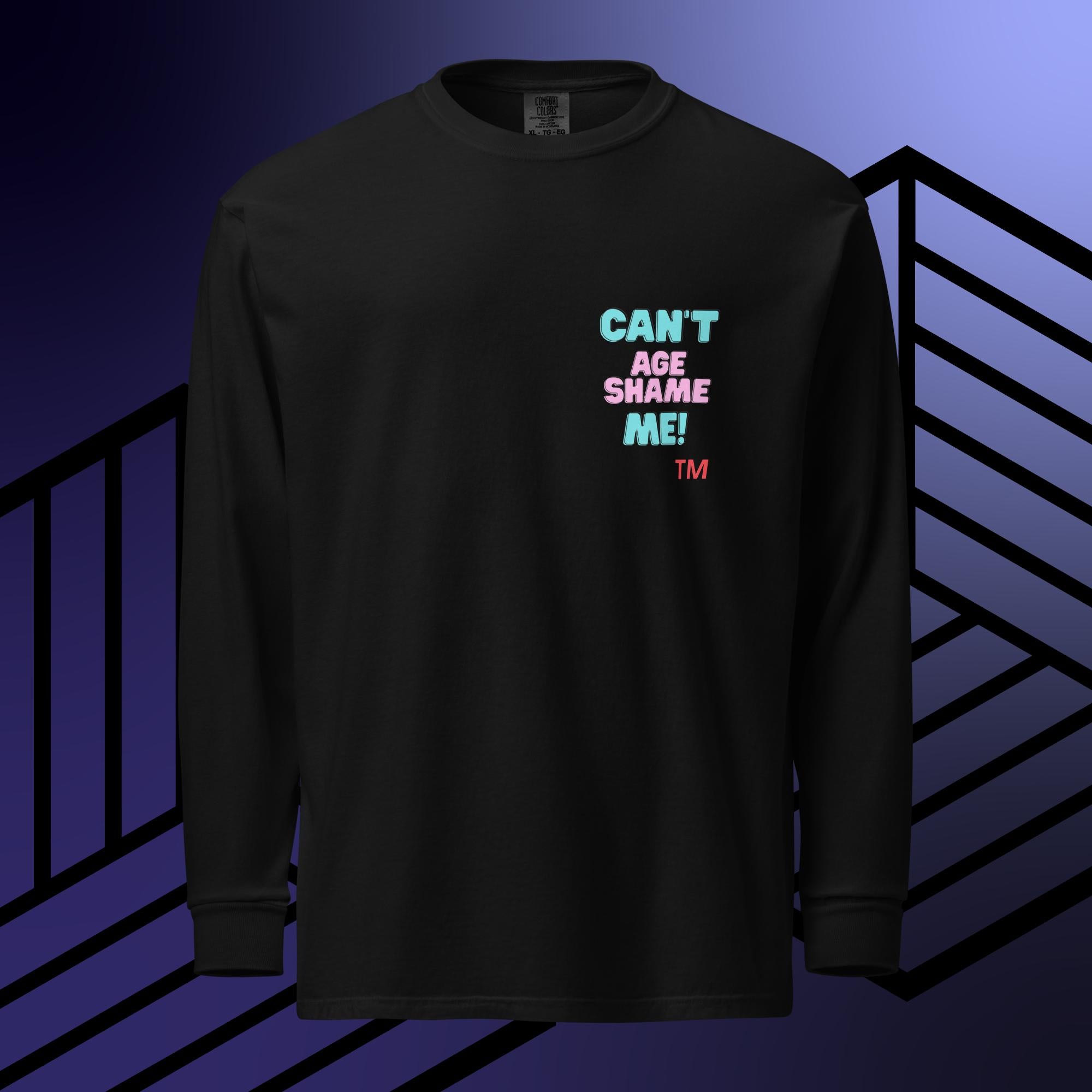 Black long sleeve shirt with colorful text: 'Can't Age Shame Me'  on a blue and black striped background