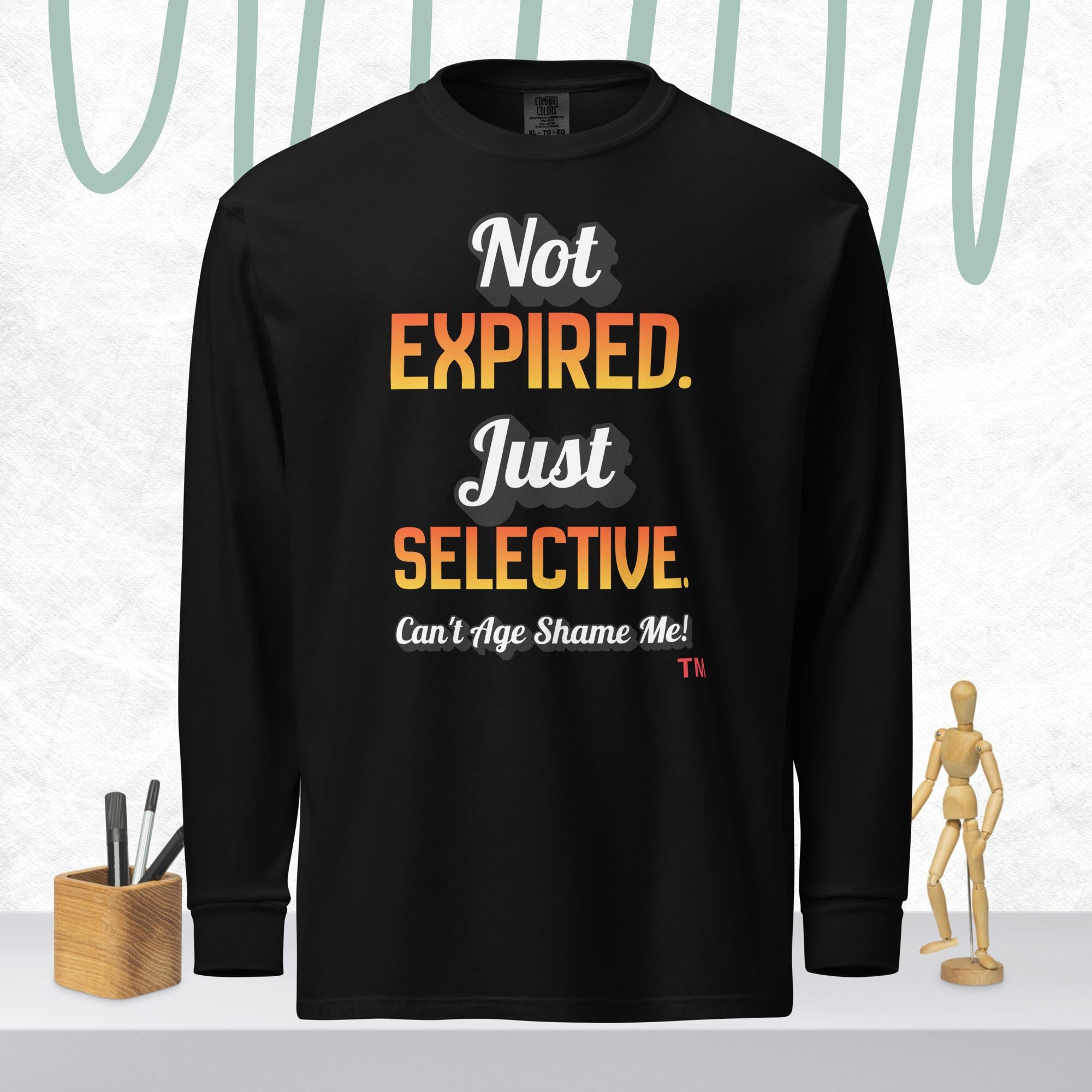 Black long-sleeve shirt with colorful text on a white background