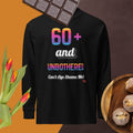 Black sweatshirt with colorful text on a brown background with chocolate, tulips, and cookies.