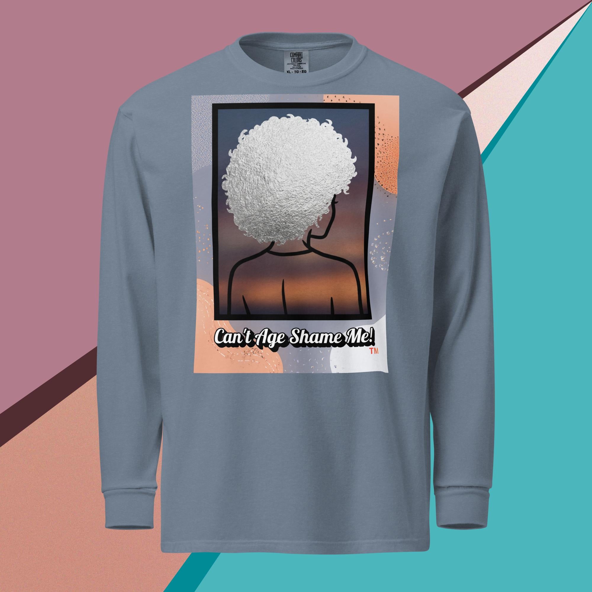 Blue Jean long-sleeve shirt with a graphic design of a person with textured hair and text 'Can't Age Shame Me!' on a colorful background.