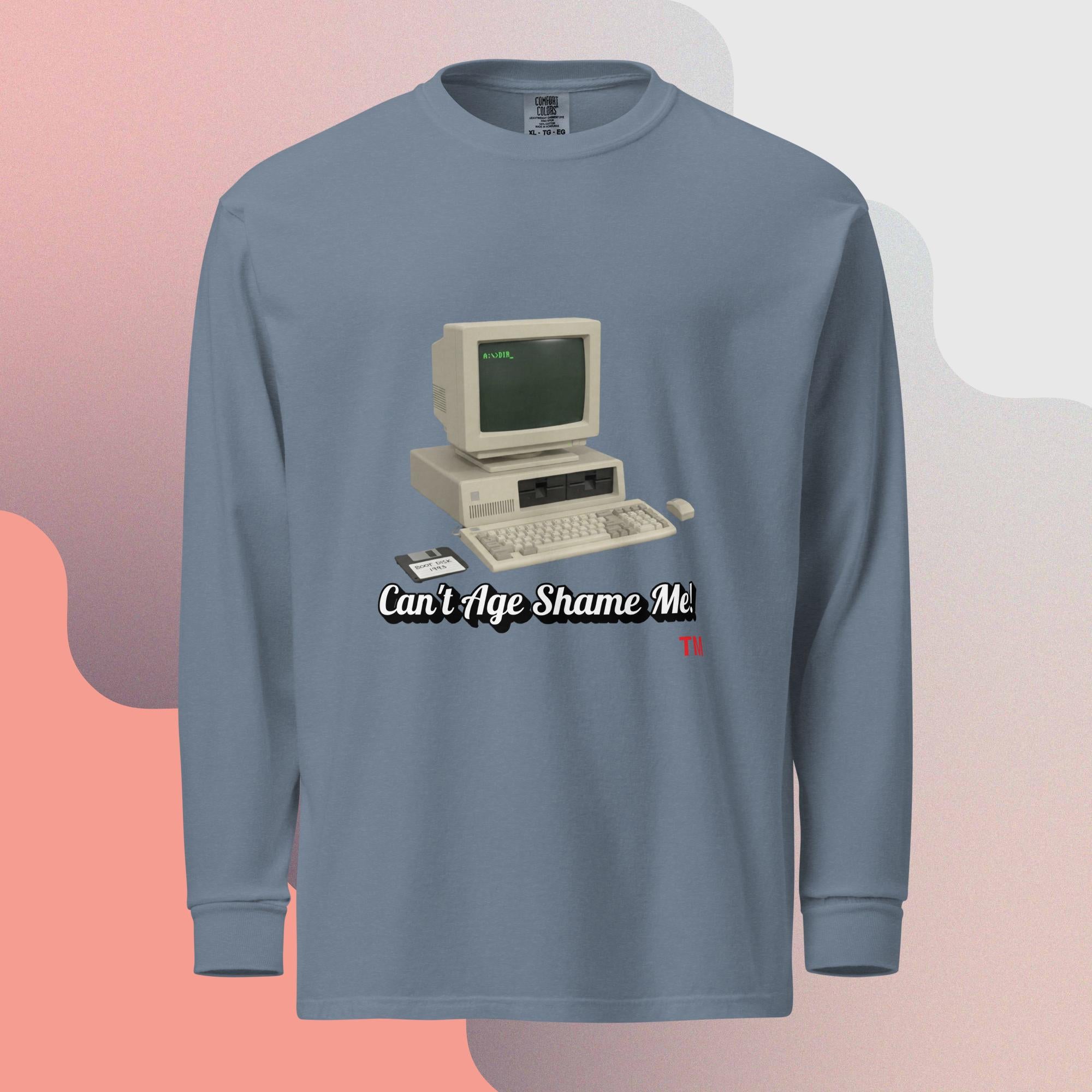 Blue  jean long-sleeve shirt with a vintage computer graphic and text  can't age shame me on a gradient background