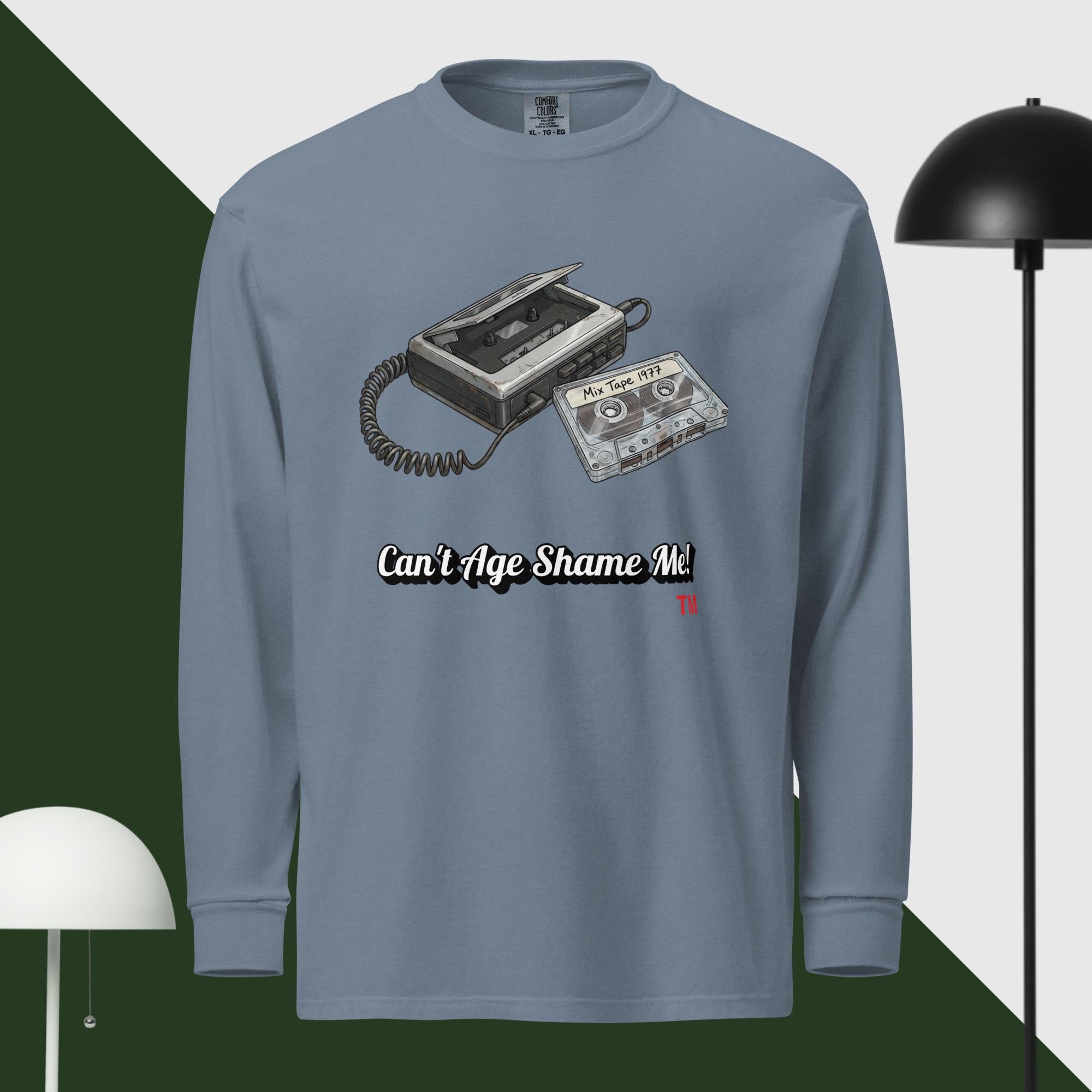 Blue jean long-sleeve shirt with cassette tape design and text 'Can't Age Shame Me' on a green and white background.